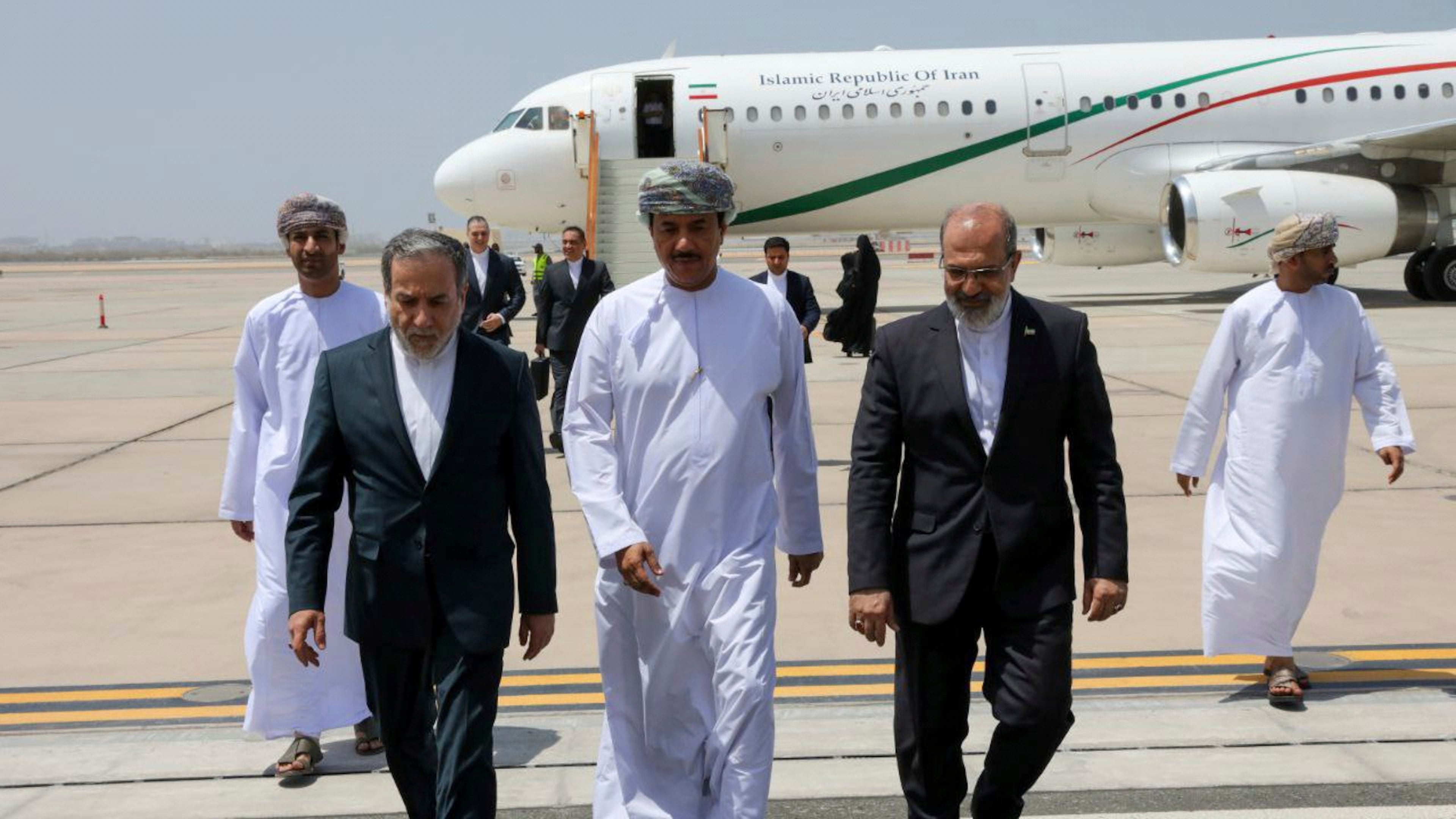 FILE - In this photo released by the Iranian Foreign Ministry, Iranian Foreign Minister Abbas Araghchi, left, is welcomed by an unidentified Omani official, center, upon his arrival at Muscat, Oman, for negotiations with U.S. Mideast envoy Steve Witkoff, as Iranian Ambassador to Oman Mousa Farhang walks at right, May 11, 2025. (Iranian Foreign Ministry via AP, File)