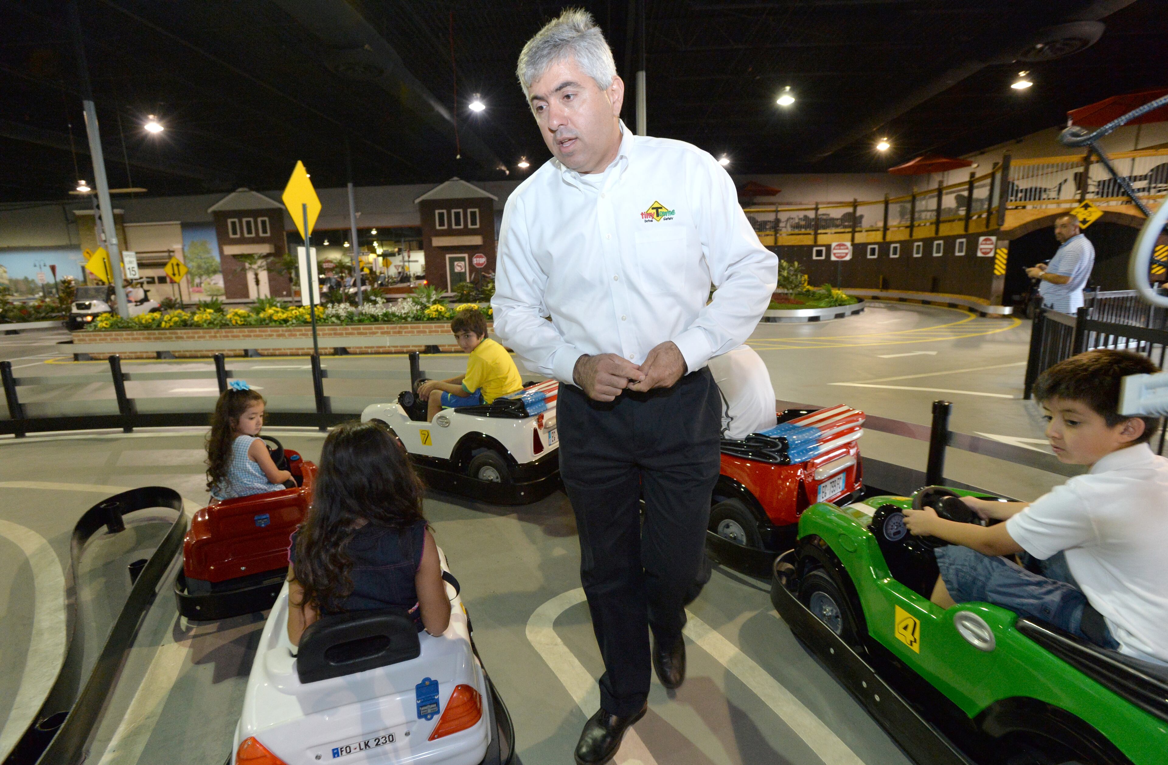 Pierre Maalouf, founder and CEO of Tiny Towne, supervises children July 8, 2014 at Tiny Towne in Norcross.