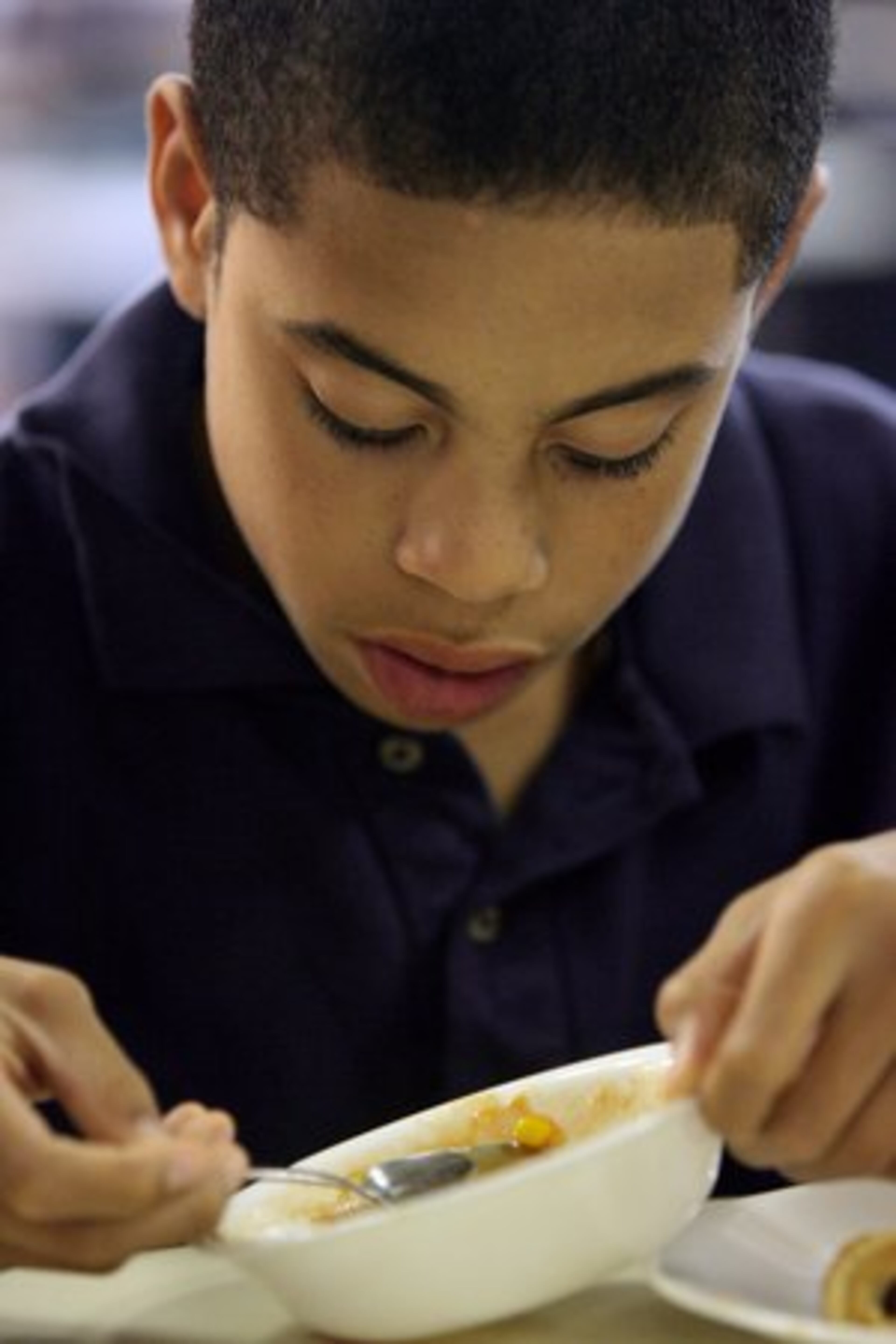 Fourteen-year-old Drew Brown enjoys soup during lunch in the Lovett dining hall. Many of the Lovett students say that the locally grown produce tastes better. Meredith Statler says, "The students are our first customer and we want them to be happy. But I want the students to be thinking about where their food comes from."
