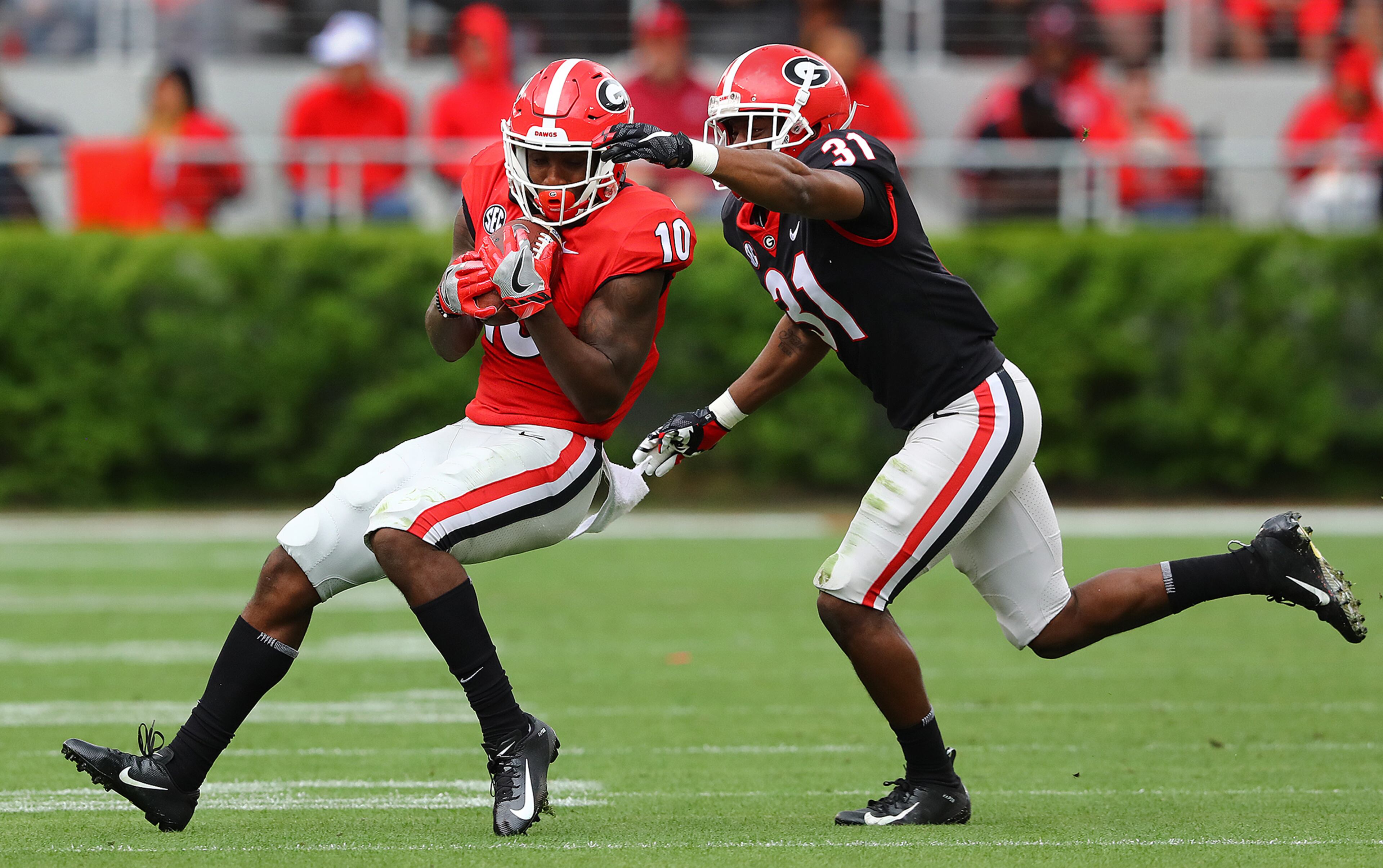 Georgia wide receiver Kearis Jackson catches a pass past defensive back William Poole during the annual G-Day football game on Saturday, April 20, 2019, in Athens. Curtis Compton/ccompton@ajc.com
