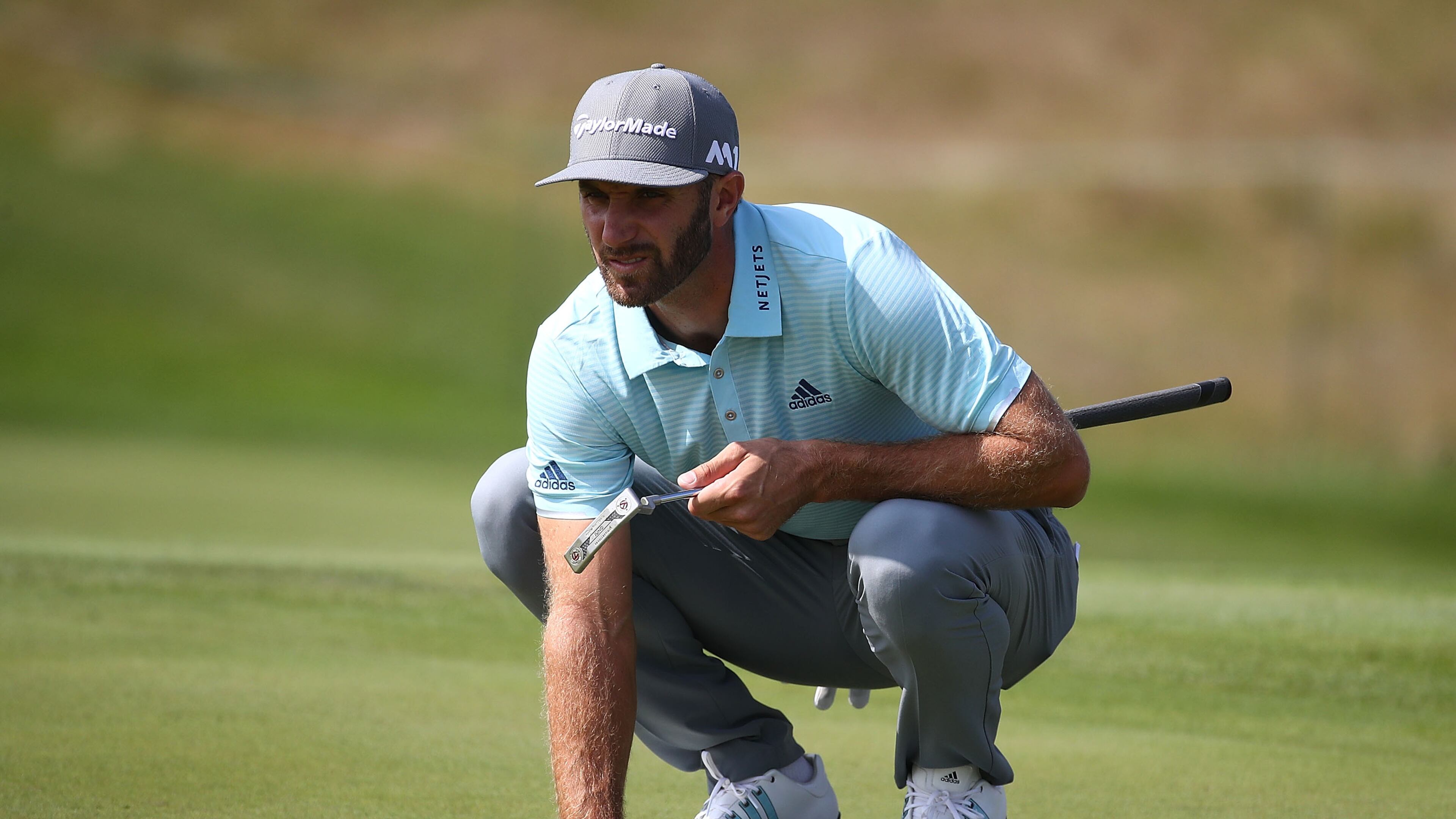 Dustin Johnson demonstrates his version of a three-point stance prior to this week's Tour Championship at East Lake.(Greg Shamus/Getty Images)