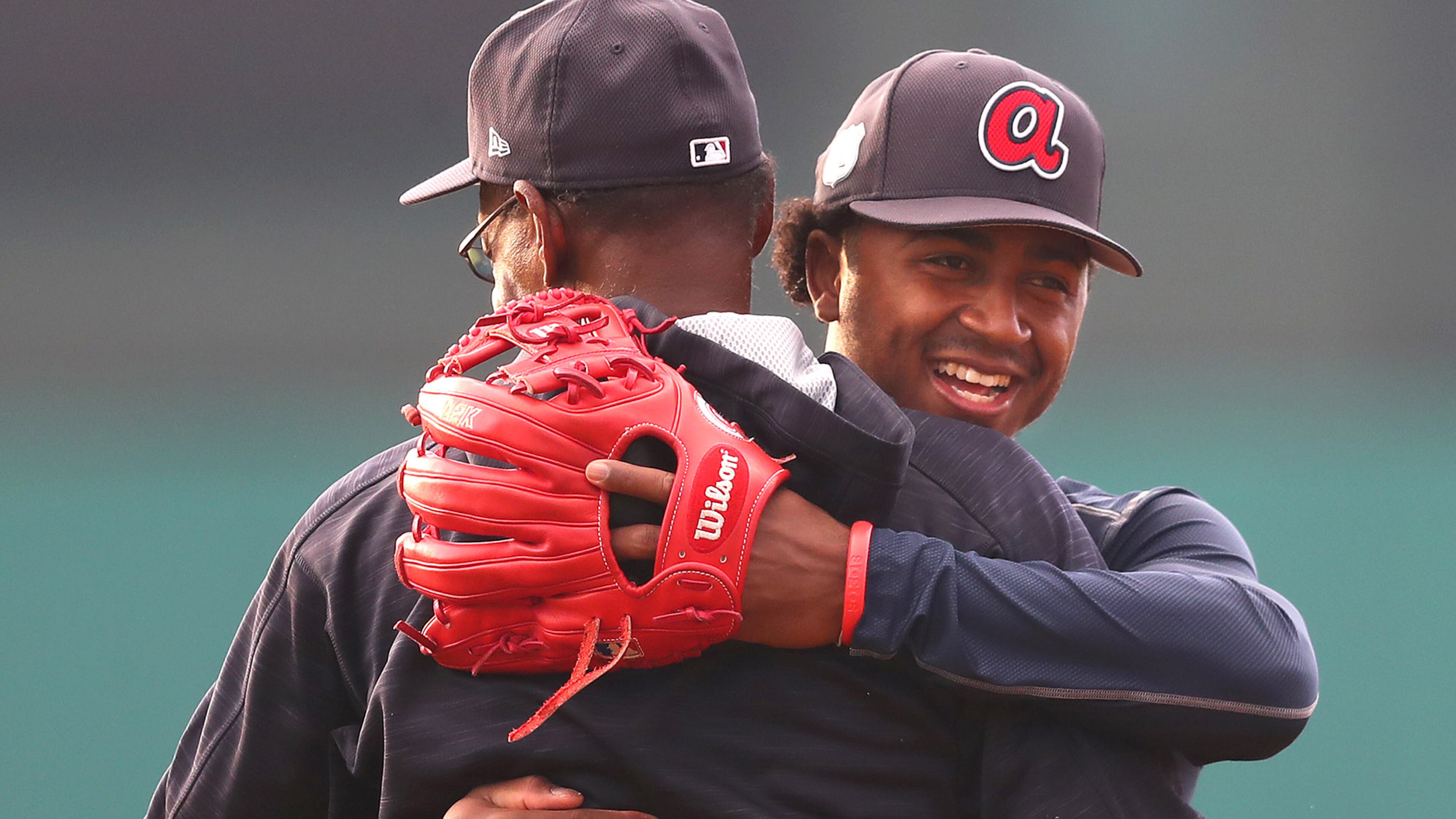 February 15, 2017, Lake Buena Vista, FL: Braves infielder Ozzie Albies hugs coach Ron Washington after getting in an early start at spring training in Champion Stadium while the Braves pitchers and catchers prepare to hold their first workout on Wednesday Feb. 15, 2017, at the ESPN Wide World of Sports in Lake Buena Vista. Curtis Compton/ccompton@ajc.com