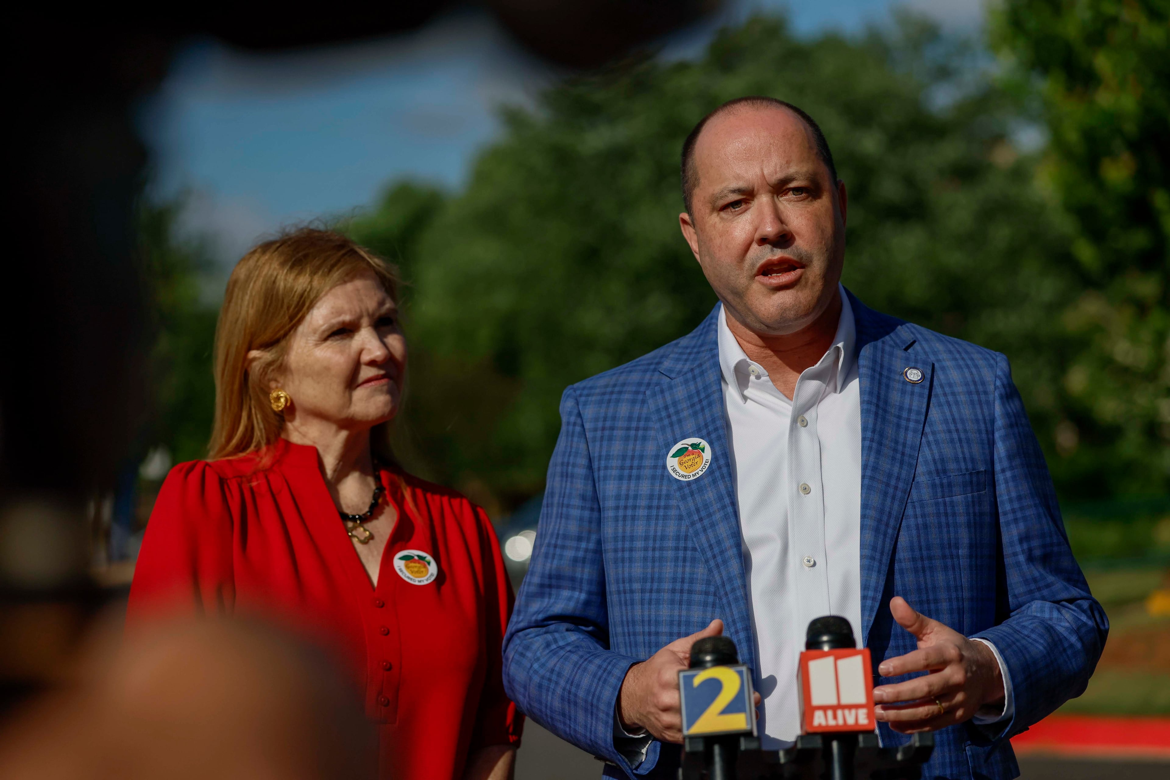Attorney General Chris Carr and his wife, Joan Carr, speak to the press after voting on the first day of early voting for the primary elections at the Dunwoody Library on Monday, April 27, 2026.
(Miguel Martinez/AJC)