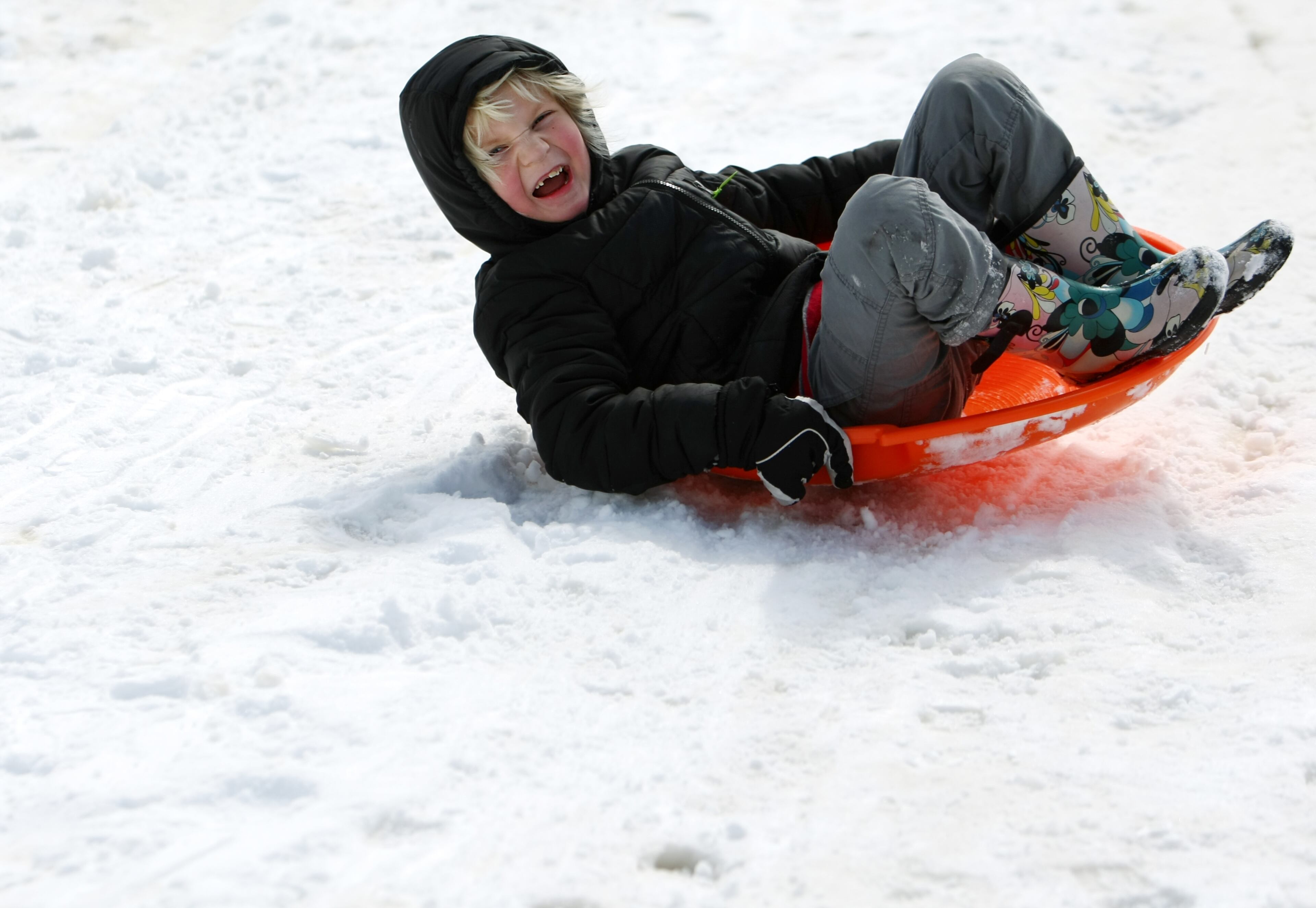 Hopper Harmon careens down the hill, Thursday, March 5, 2015 at the Levitt Shell in Overton Park in Memphis, Tenn. (AP Photo/The Commercial Appeal, Mike Brown)