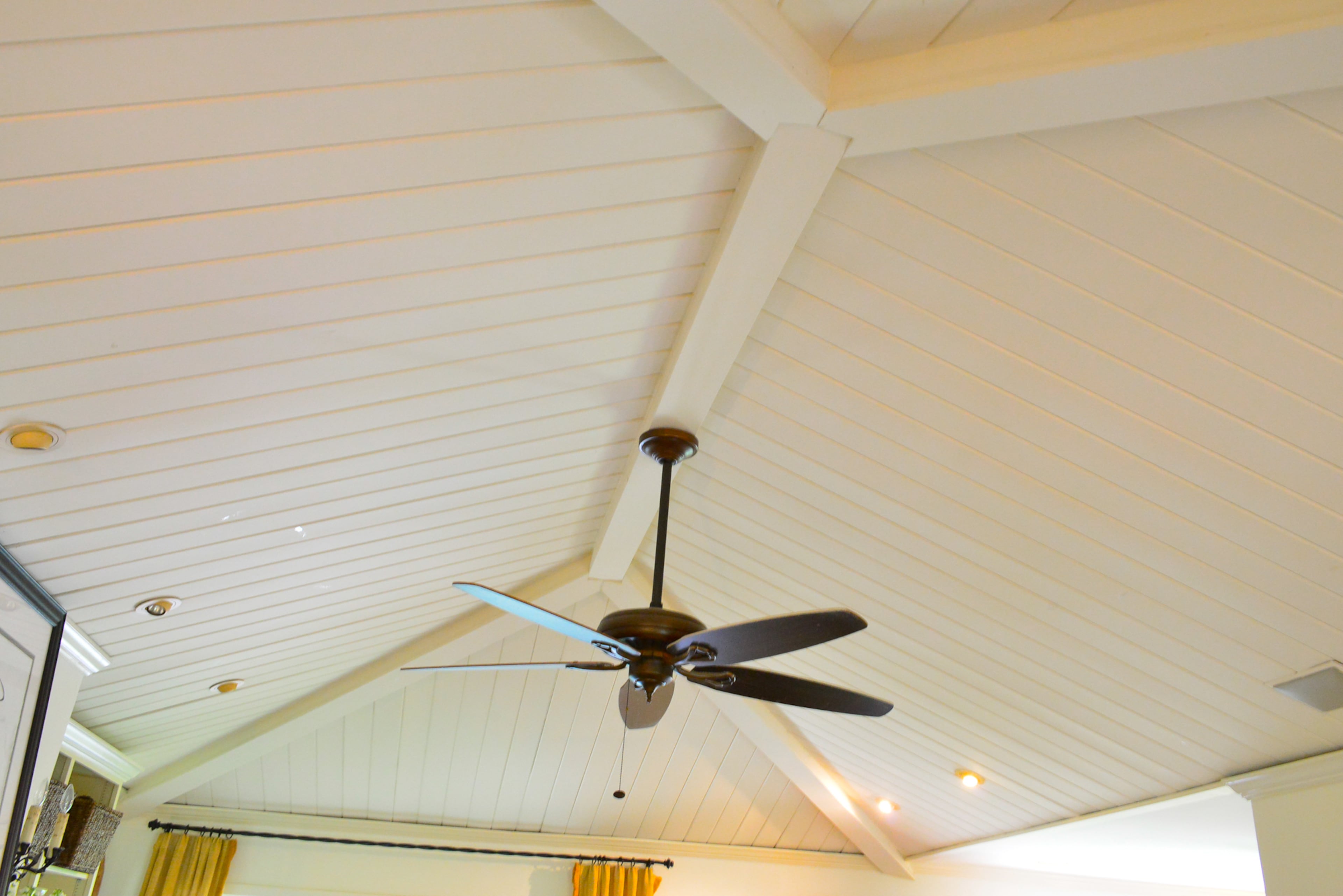 The vaulted ceiling in the family room enhances the open floor plan and feeling of the home. The fan is from The Home Depot.