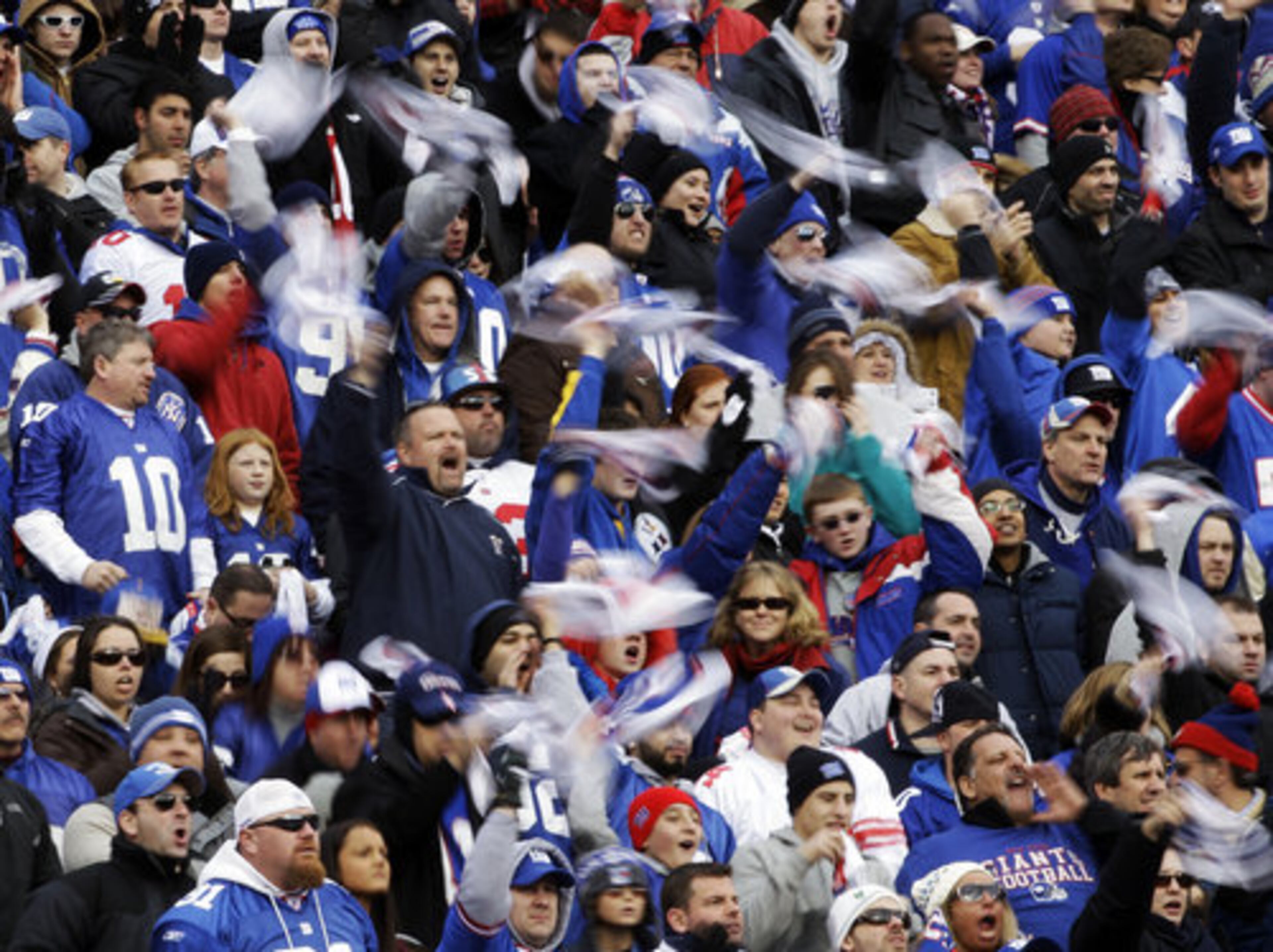 New York Giants fans cheer during the first half of an NFL wild card playoff football game between the Atlanta Falcons and the New York Giants Sunday, Jan. 8, 2012, in East Rutherford, N.J.