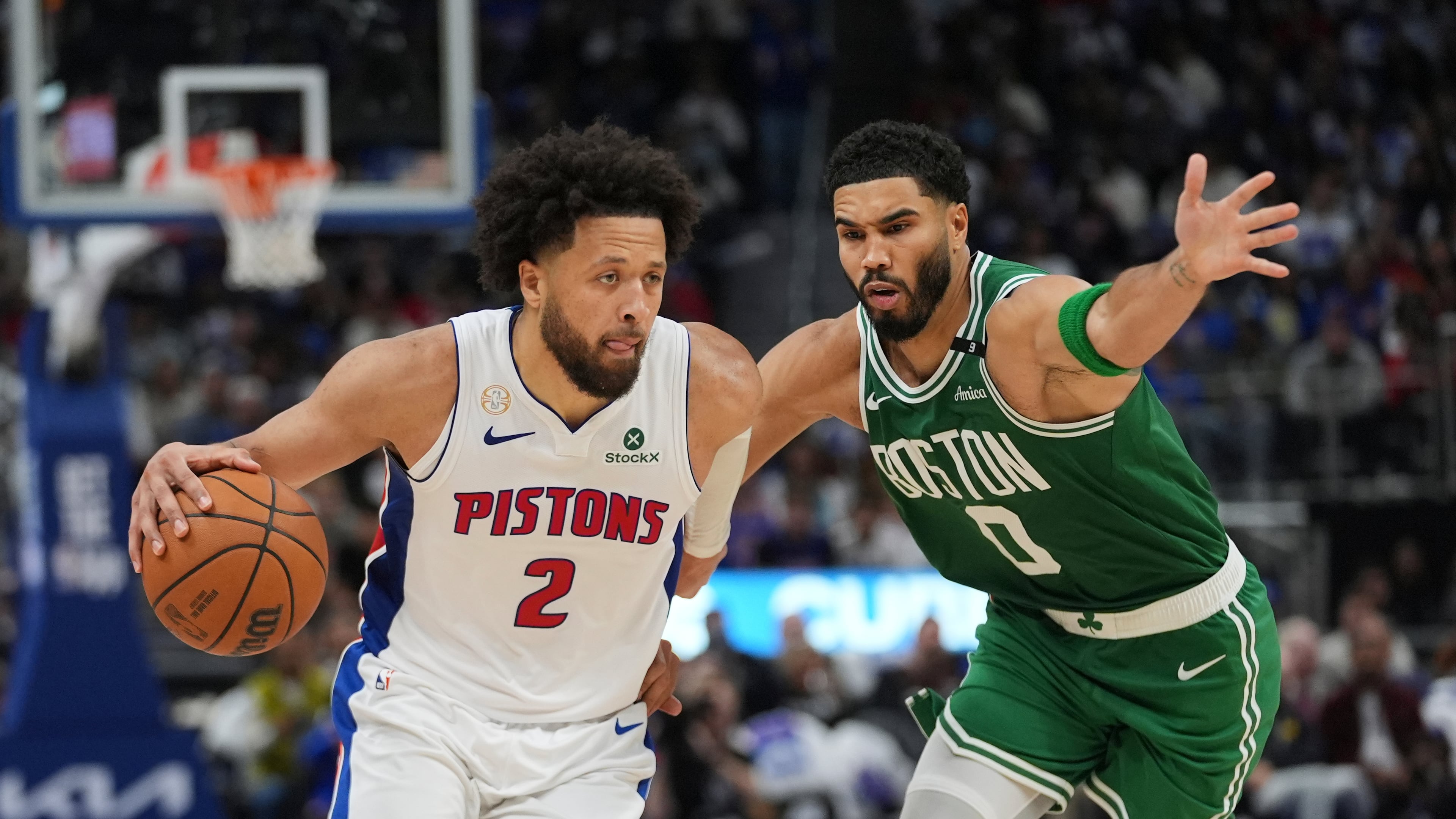 Detroit Pistons guard Cade Cunningham (2) drives on Boston Celtics forward Jayson Tatum (0) in the second half of an NBA basketball game in Detroit, Tuesday, Oct. 20, 2026. (AP Photo/Paul Sancya)