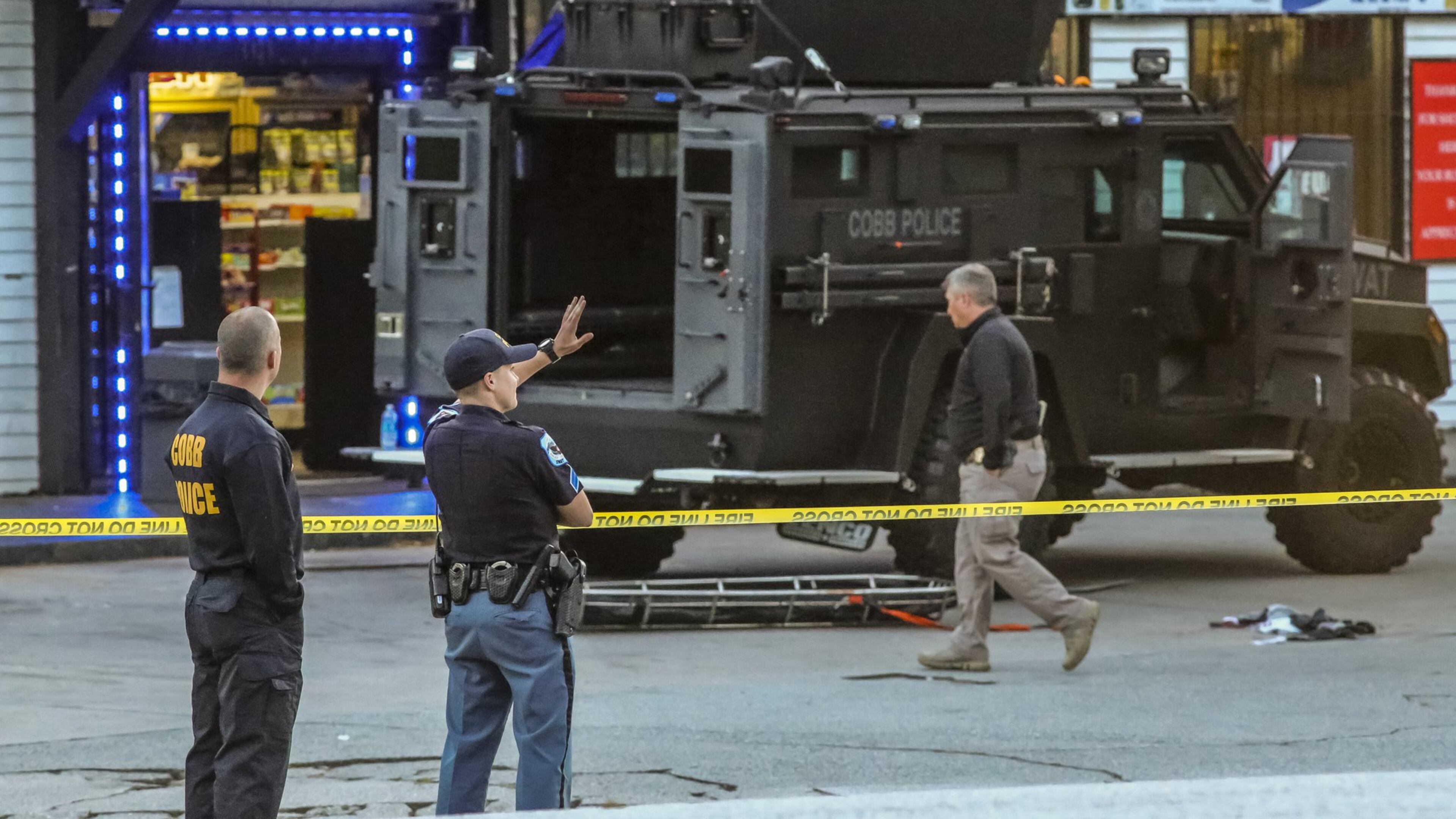 An armed robbery suspect was shot by a Cobb County police officer in an early Monday, April 18, 2016, SWAT standoff that lasted hours at a Marathon gas station on Mableton Parkway. (JOHN SPINK / JSPINK@AJC.COM)