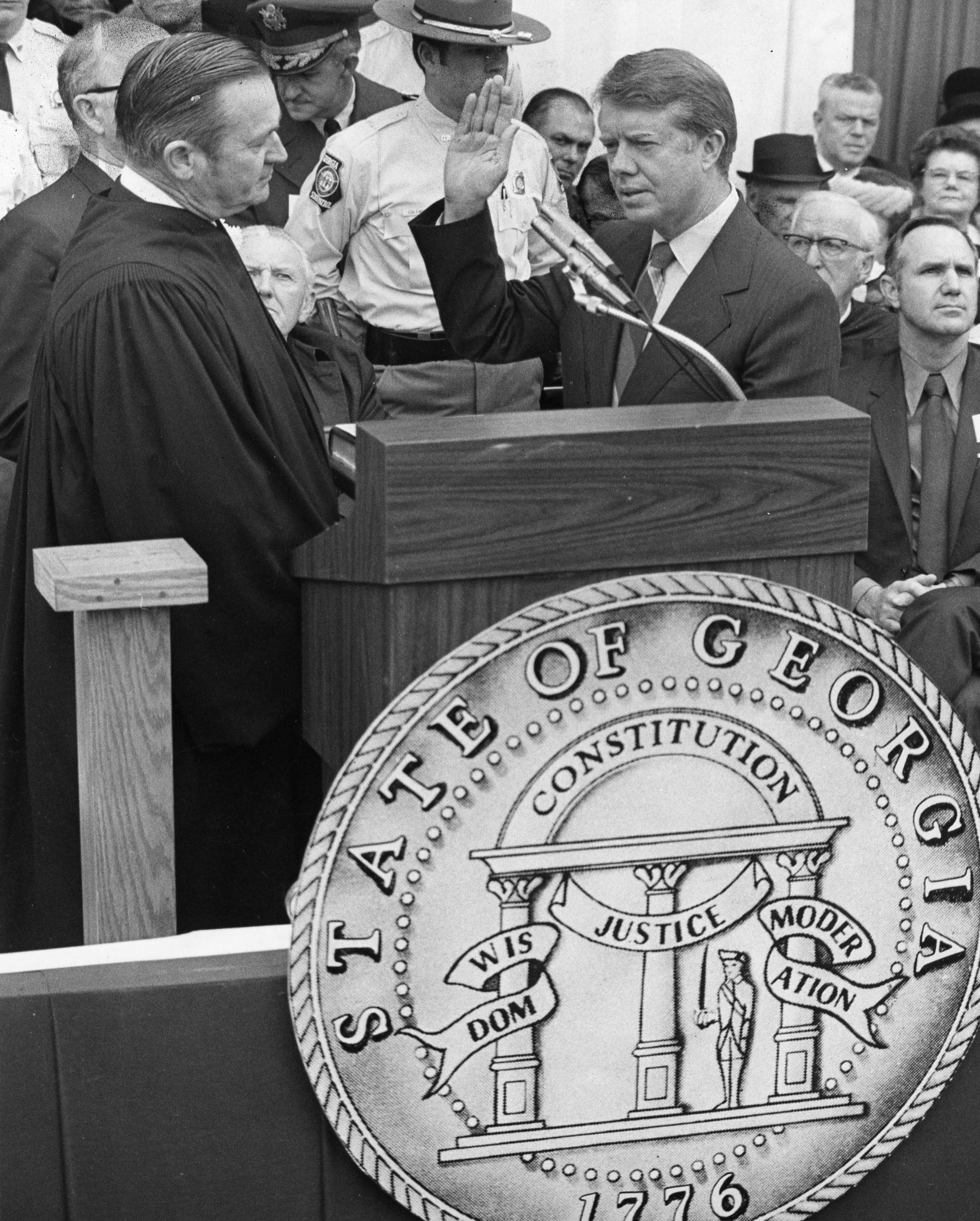 Jimmy Carter takes the oath of office as Georgia's 76th governor from Justice Robert H. Jordan on Jan. 12, 1971, in Atlanta. The man Carter succeeded as the state's chief executive, Lester Maddox, appears in the photograph behind Jordan but his face is obscured. Maddox served as the state's lieutenant governor while Carter was governor, though the two men did not run on the same ticket and were often at distant ends of the spectrum on political issues of the day. Maddox died in 2003; Jordan died in 1992.