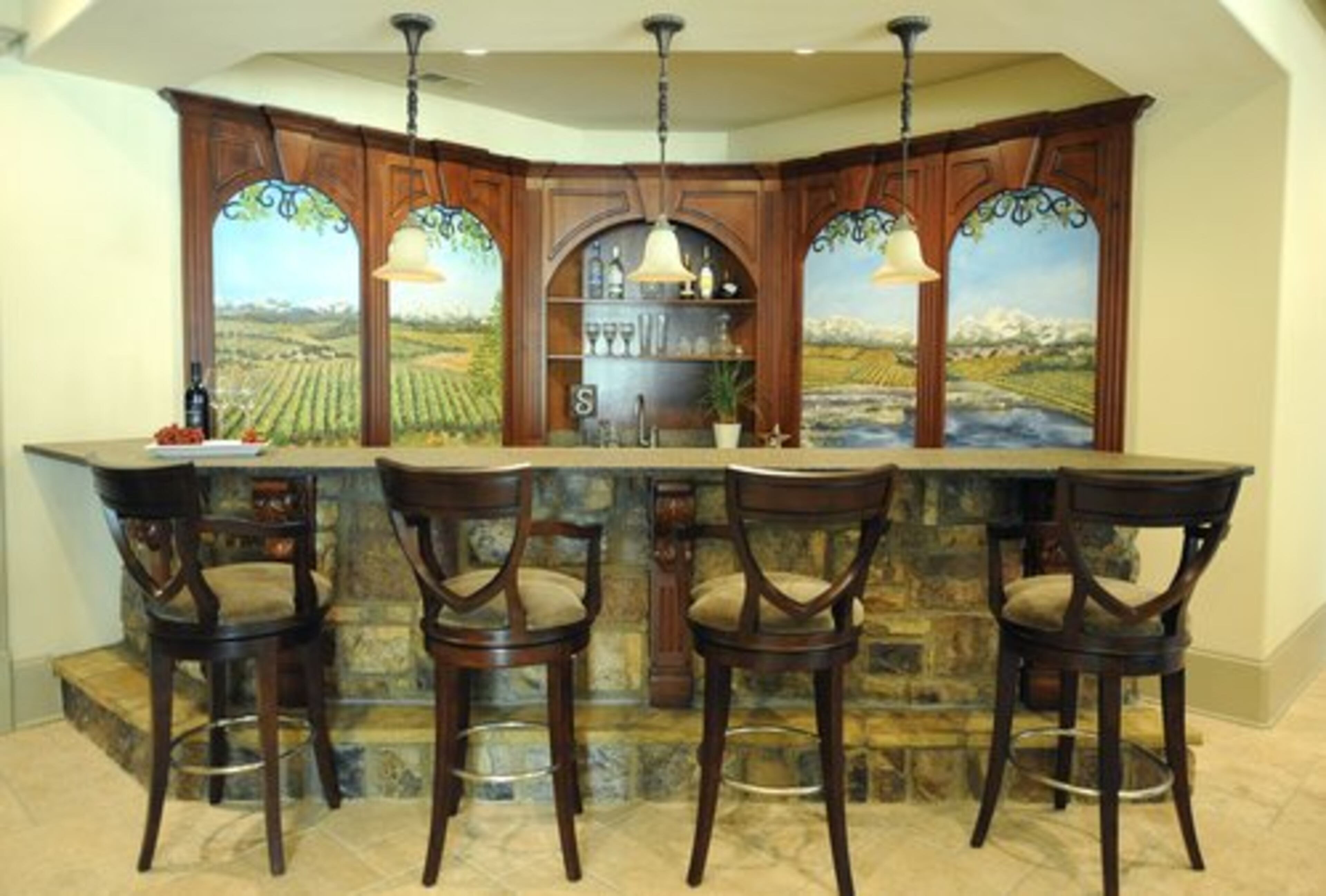 The stone bar on the terrace level has a pastoral mural.