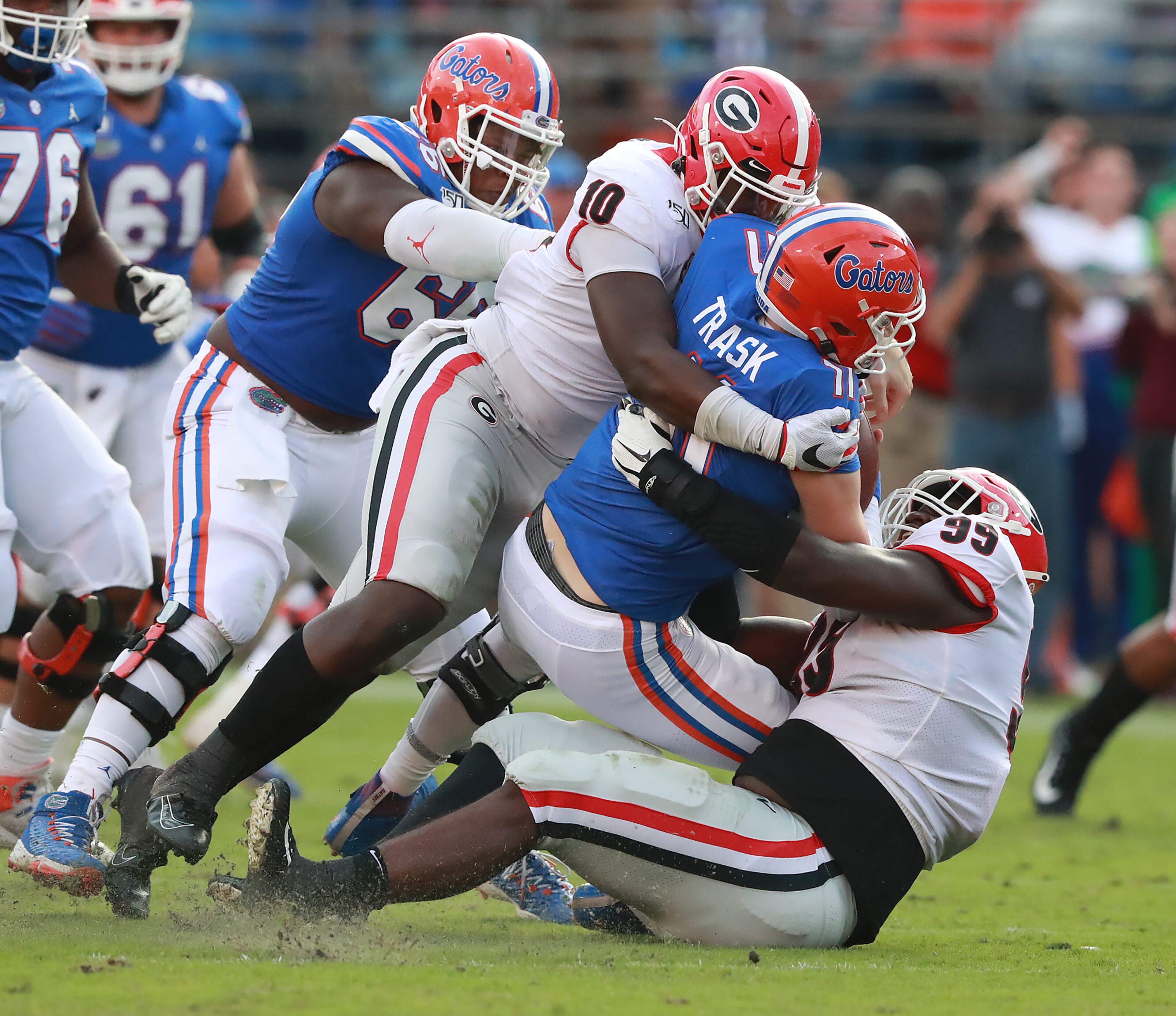 Georgia defensive linemen Malik Herring (left) and Jordan Davis (right) sack Florida quarterback Kyle Trask during the third quarter in a NCAA college football game on Saturday, November 2, 2019, in Jacksonville. Curtis Compton/ccompton@ajc.com
