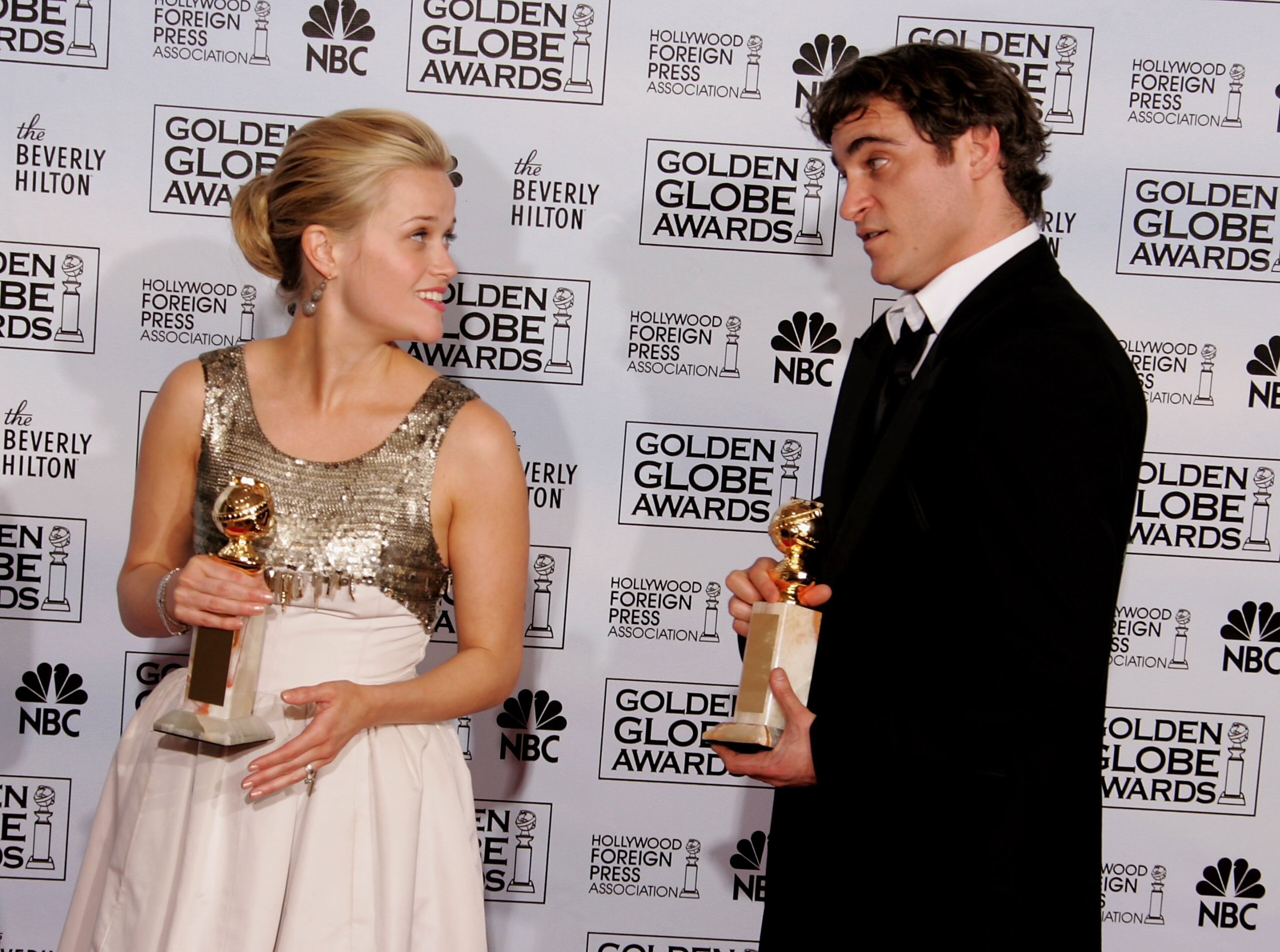 Actress Reese Witherspoon and actor Joaquin Phoenix with their awards for Best Actress and Best Actor, Musical or Comedy for "Walk The Line" pose backstage during 63rd Annual Golden Globe Awards at the Beverly Hilton on January 16, 2006 in Beverly Hills, California. (Photo by Kevin Winter/Getty Images)