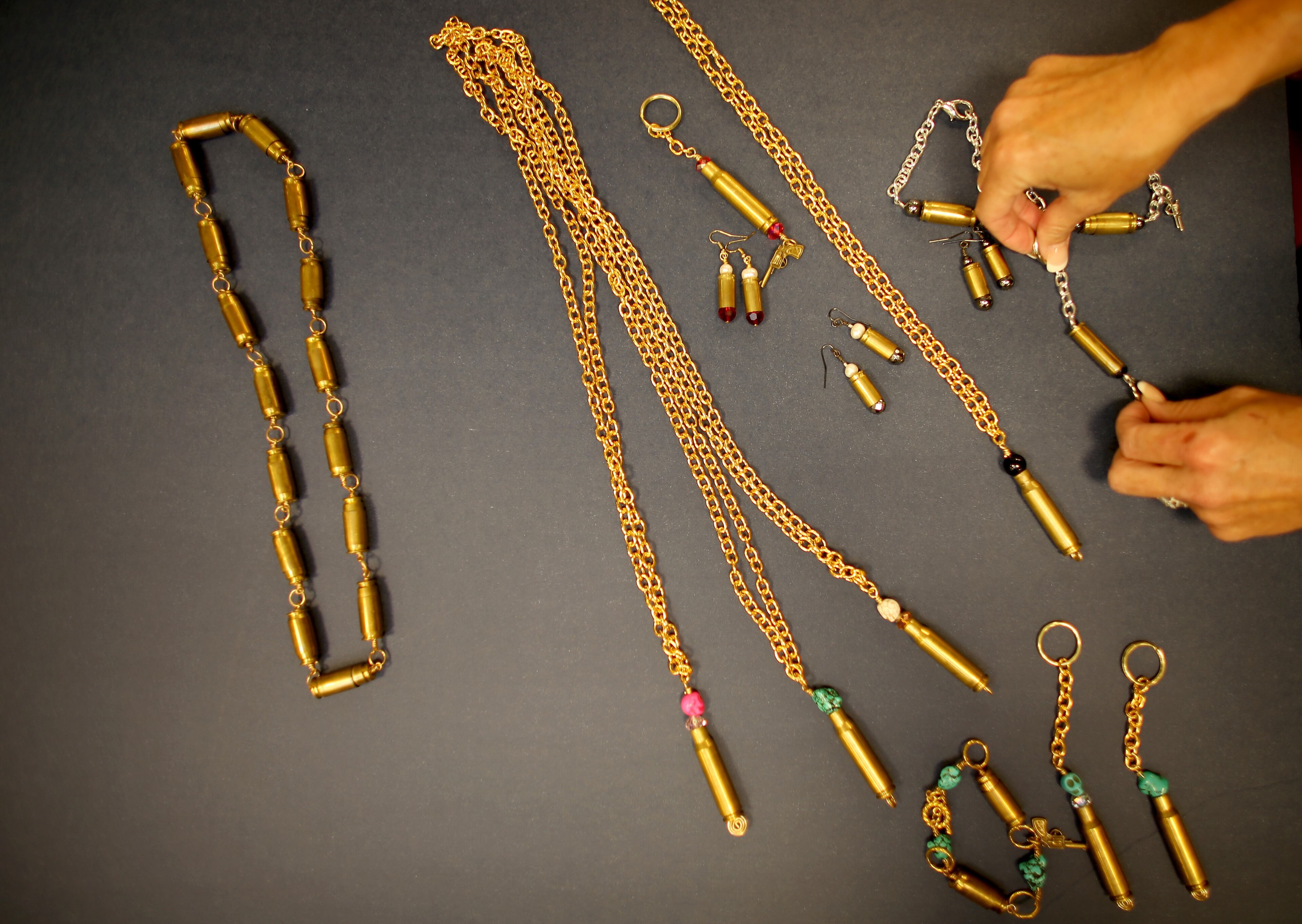 Some of the bracelets, earrings and necklaces available from Gun Girls Inc.