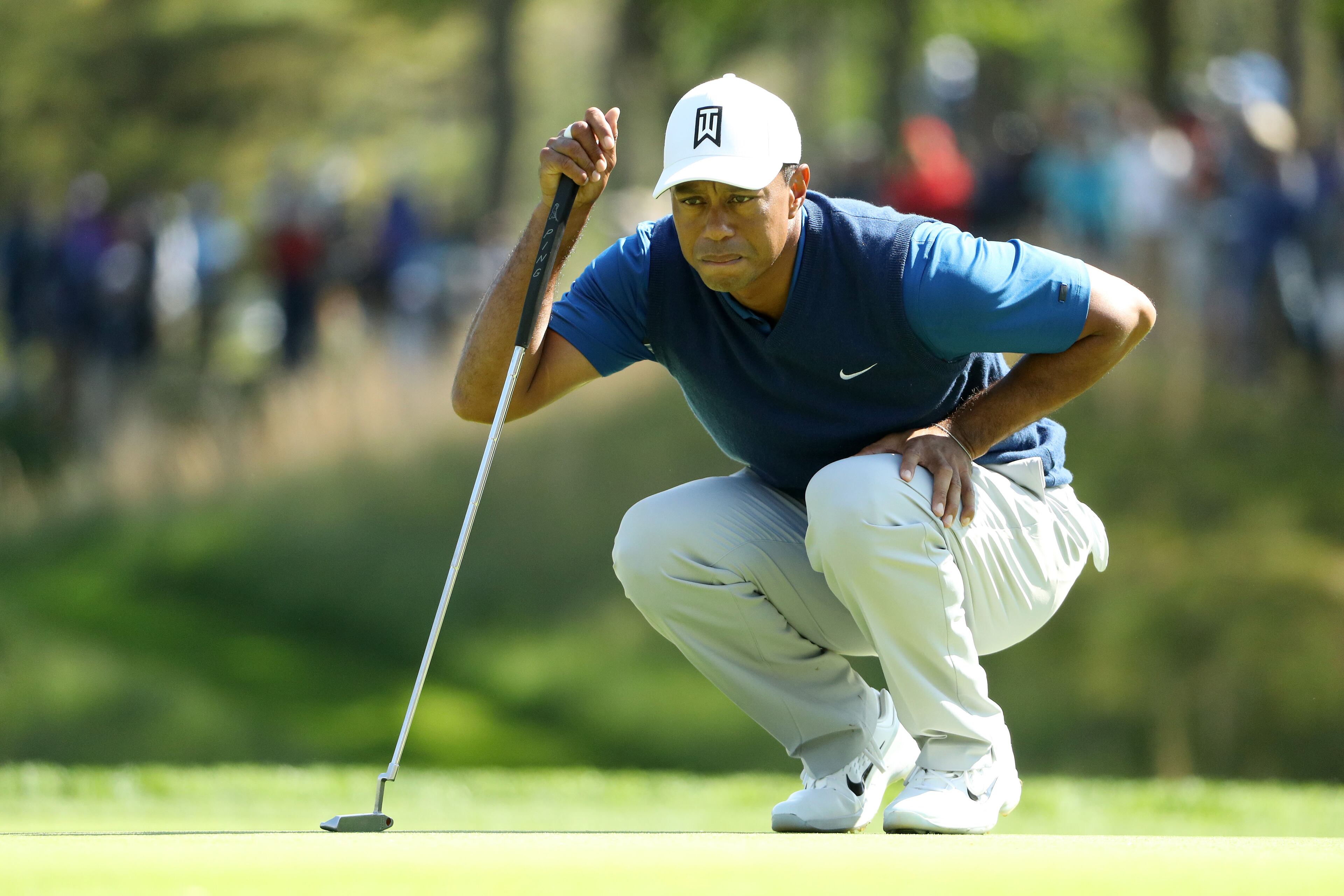 Tiger Woods lines up a putt during Thursday's first round of the 2019 PGA Championship at Bethpage Black in Farmingdale, New York. (Photo by Patrick Smith/Getty Images)
