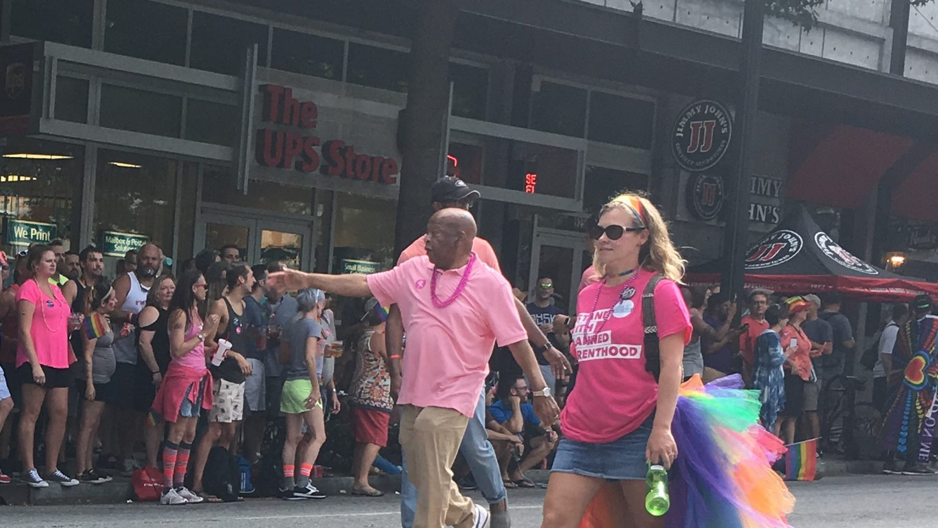 U.S. Rep. John Lewis greets the crowd at the Atlanta Pride parade. AJC/Greg Bluestein