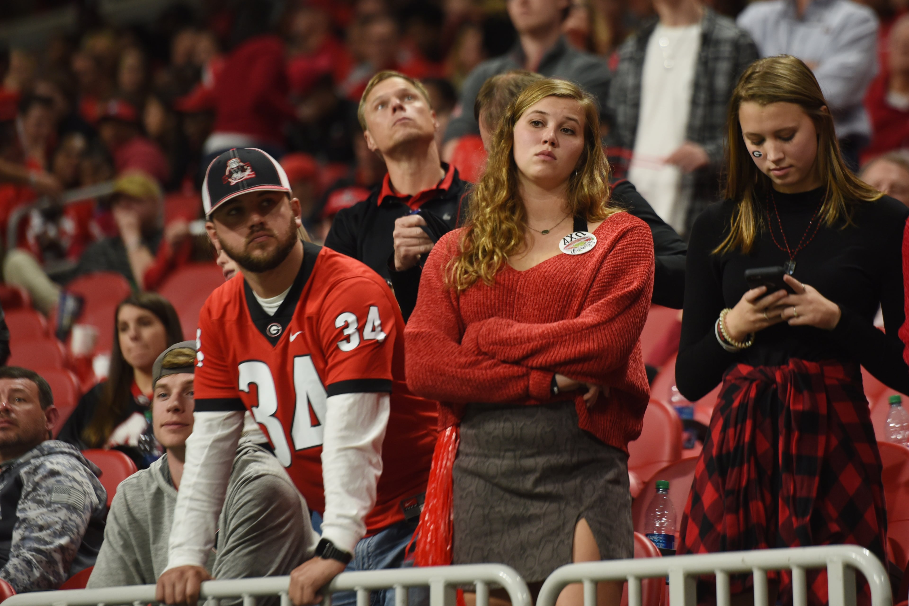 Georgia Bulldogs fans are dejected during the second half of the Georgia vs. LSU SEC Football Championship game at Mercedes-Benz Stadium in Atlanta. Ryon Horne / ryon.horne@ajc.com