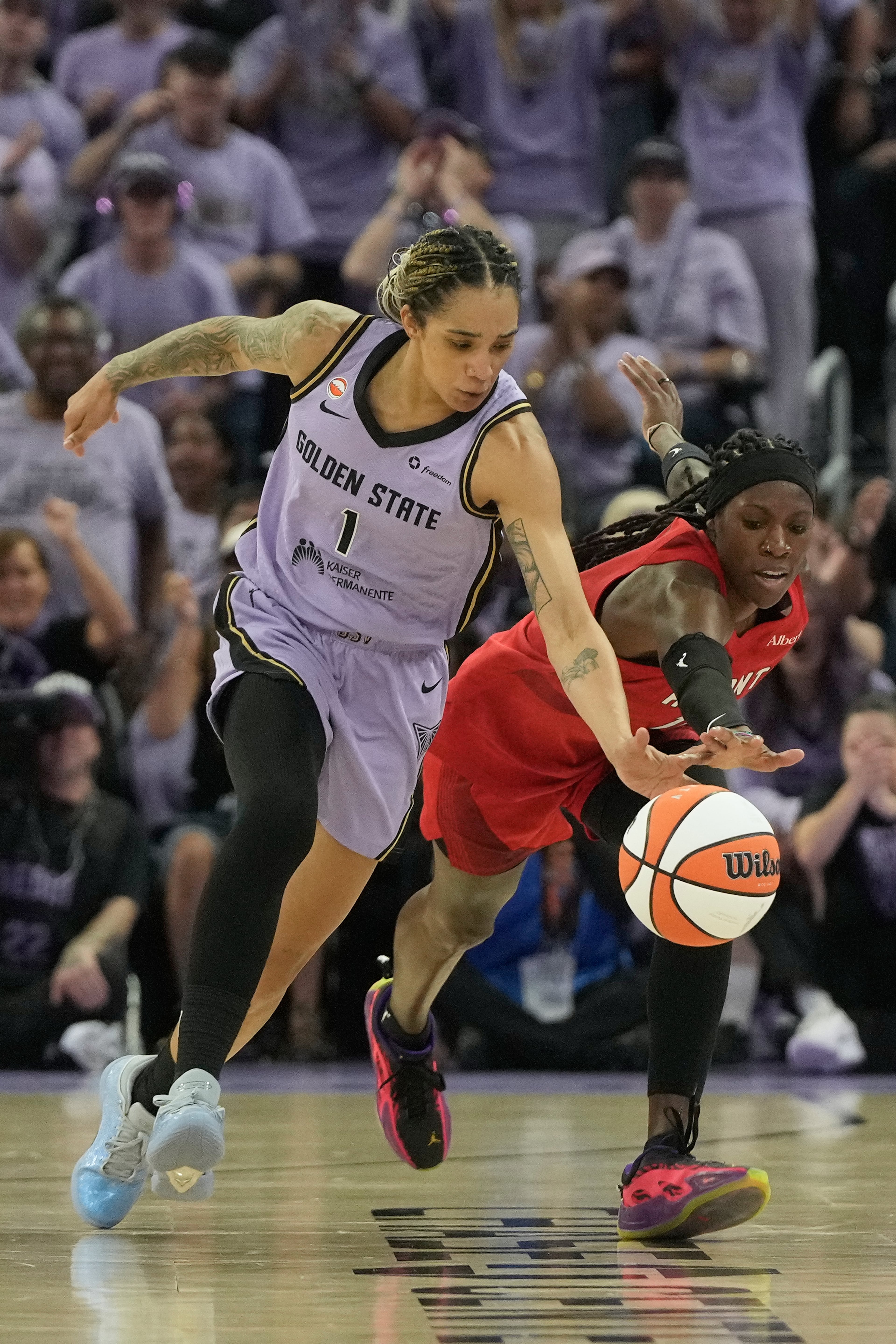 Golden State Valkyries forward Gabby Williams reaches for the ball against Atlanta Dream guard Rhyne Howard (right) during the first half of Game 1 of the WNBA basketball finals, Saturday, Oct. 17, 2026, in San Francisco. (Jeff Chiu/AP)