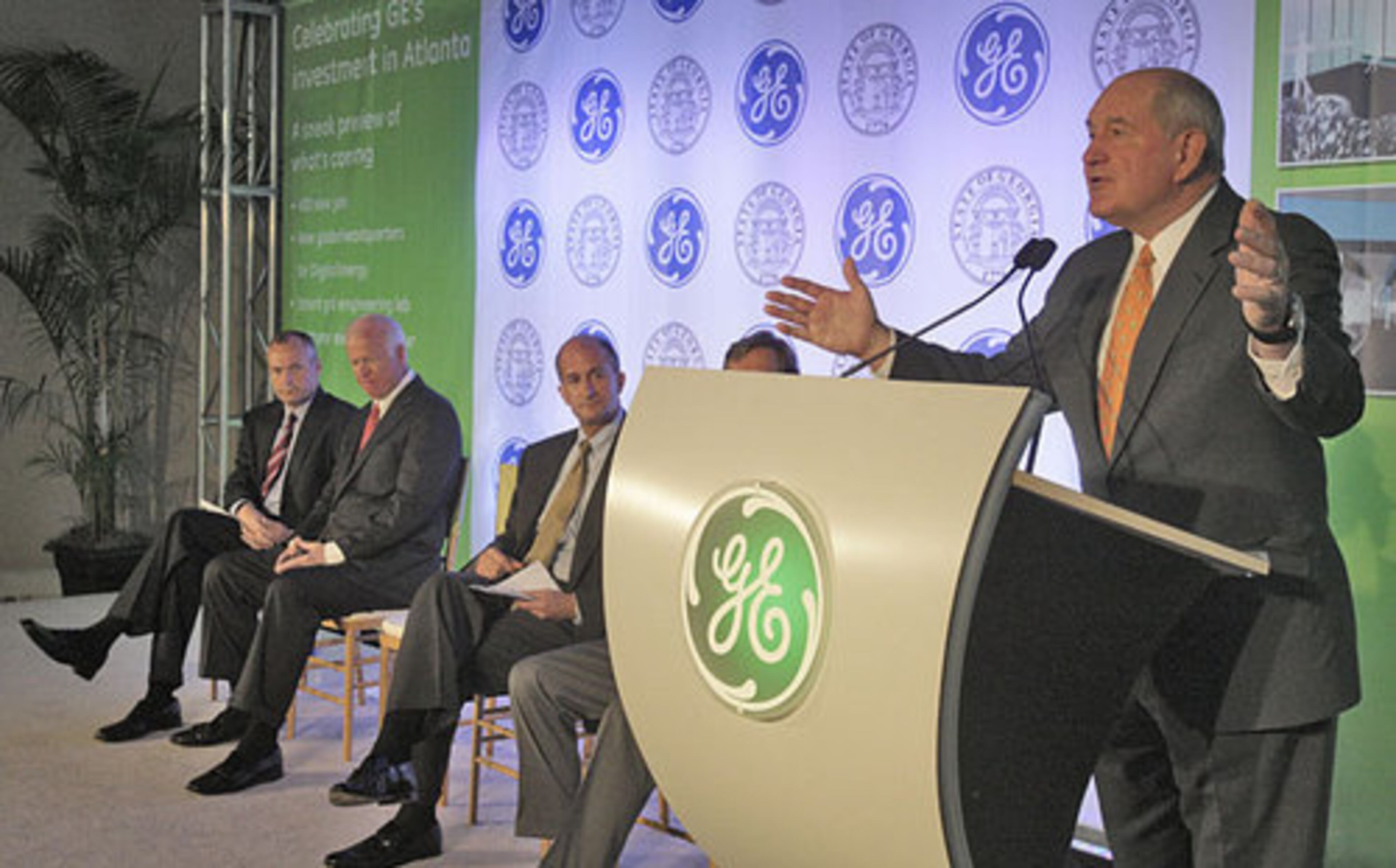 Gov. Sonny Perdue talks about the Smart Grid Technology Center at a reception at the center. From left is Lt. Gov. Casey Cagle, Sen. Saxby Chambliss, and John Rice, vice chairman of GE. GE rolled out its touted Smart Grid Technology Center of Excellence in Cobb County June 3, 2010.