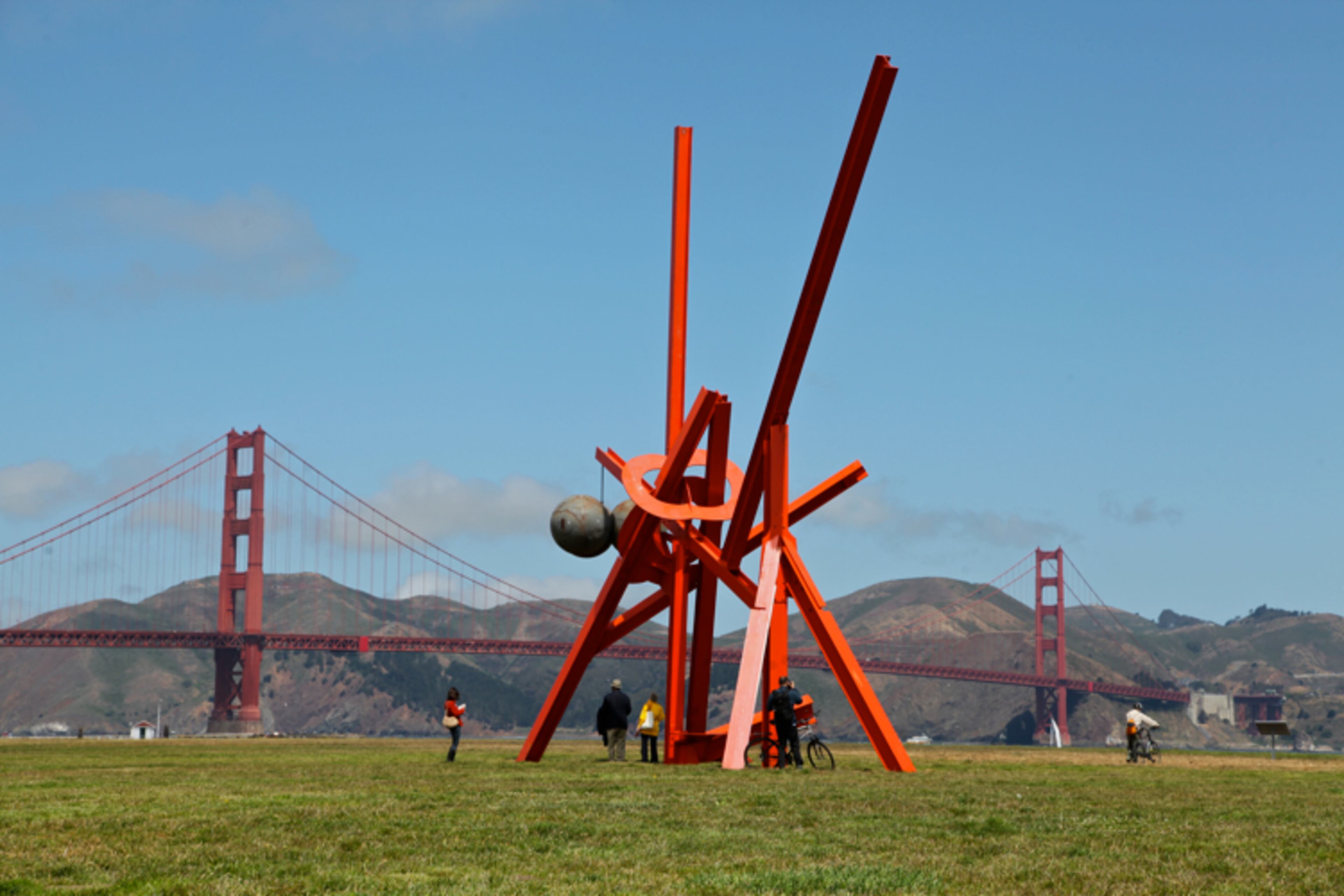 Mark di Suvero is an artist who emigrated from Shanghai to San Francisco at the age of seven. His passage beneath the Golden Gate Bridge—which opened a few years before his arrival—proved to be a lasting inspiration, as the scale and color of the structure have inspired di Suvero throughout his life. di Suvero notes, "It was like a rainbow, a bridge coming to the New World starting a new life. The woman who chose the color of the bridge, Malo Lowell, taught me how to work wood as a teenager and from there, all was freedom."
