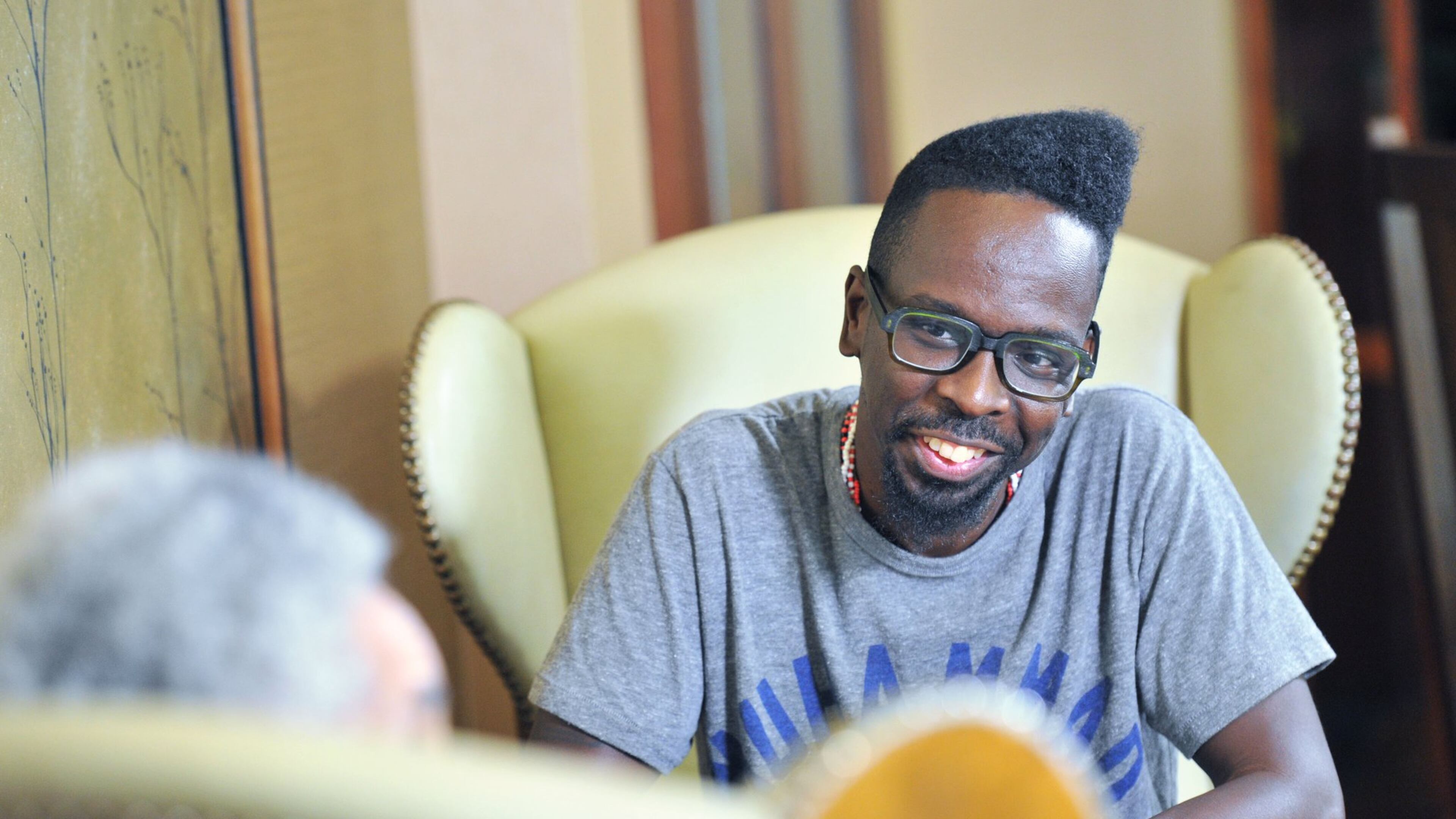 September 15, 2016 Atlanta - Atlanta based artist Fahamu Pecou reacts as he listens to filmmaker, sculptor and provocateur Camille Billops (foreground) at Emory University Conference Center Hotel on Thursday, September 15, 2016. Both have made careers exploring black identity and representation in art. Pecou’s work is in the permanent collection of the new Smithsonian African American musuem, Billops’ work is taught in colleges around the country.