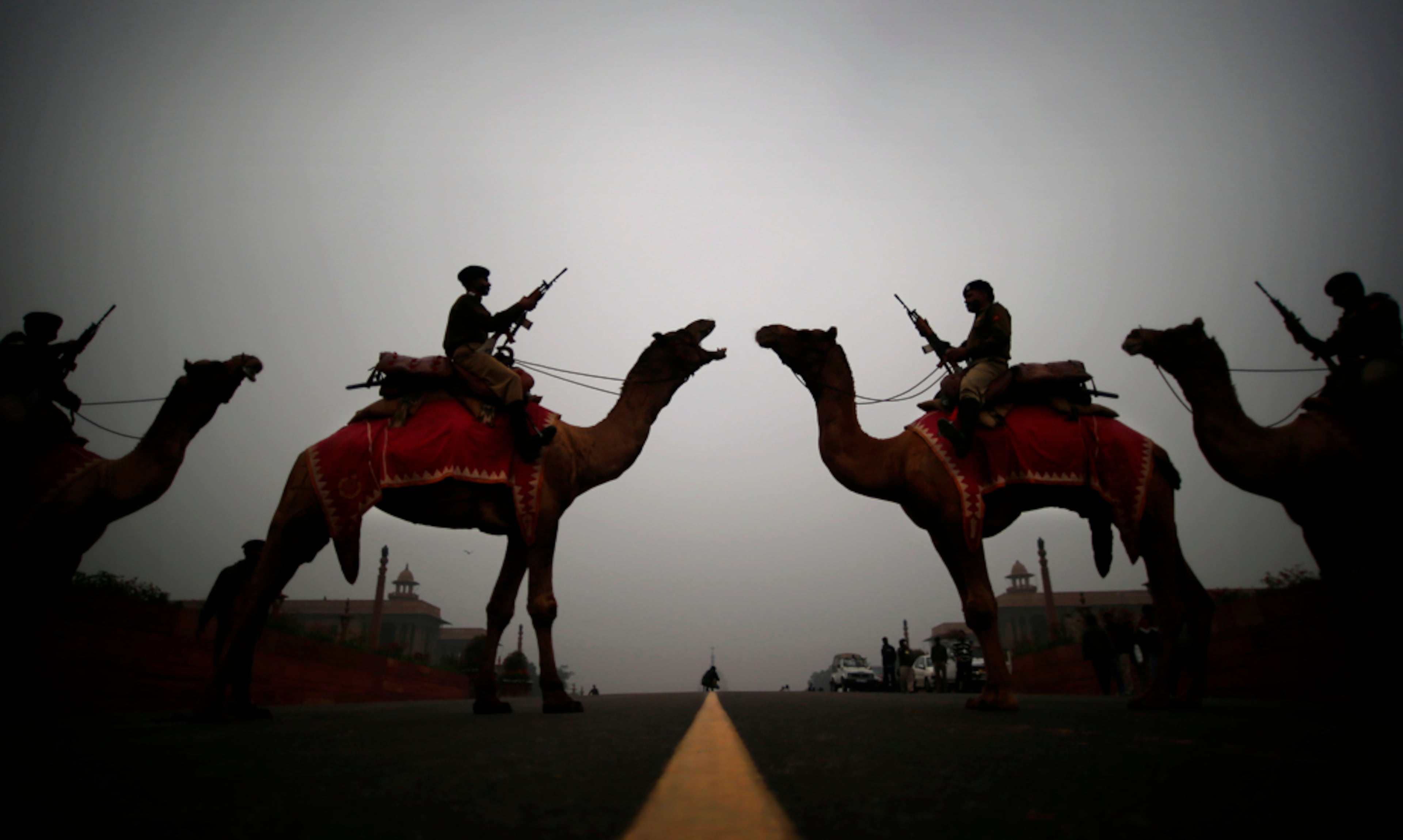RETREAT REHEARSAL--Camel mounted soldiers stand in formation during a rehearsal of the Beating Retreat ceremony at Raisina hill which houses India's most important ministries and the presidential palace, in New Delhi, India, Friday, Jan. 17, 2014. The ceremony is held annually on Jan. 29, marking the end of republic day celebrations. (AP Photo/Saurabh Das)