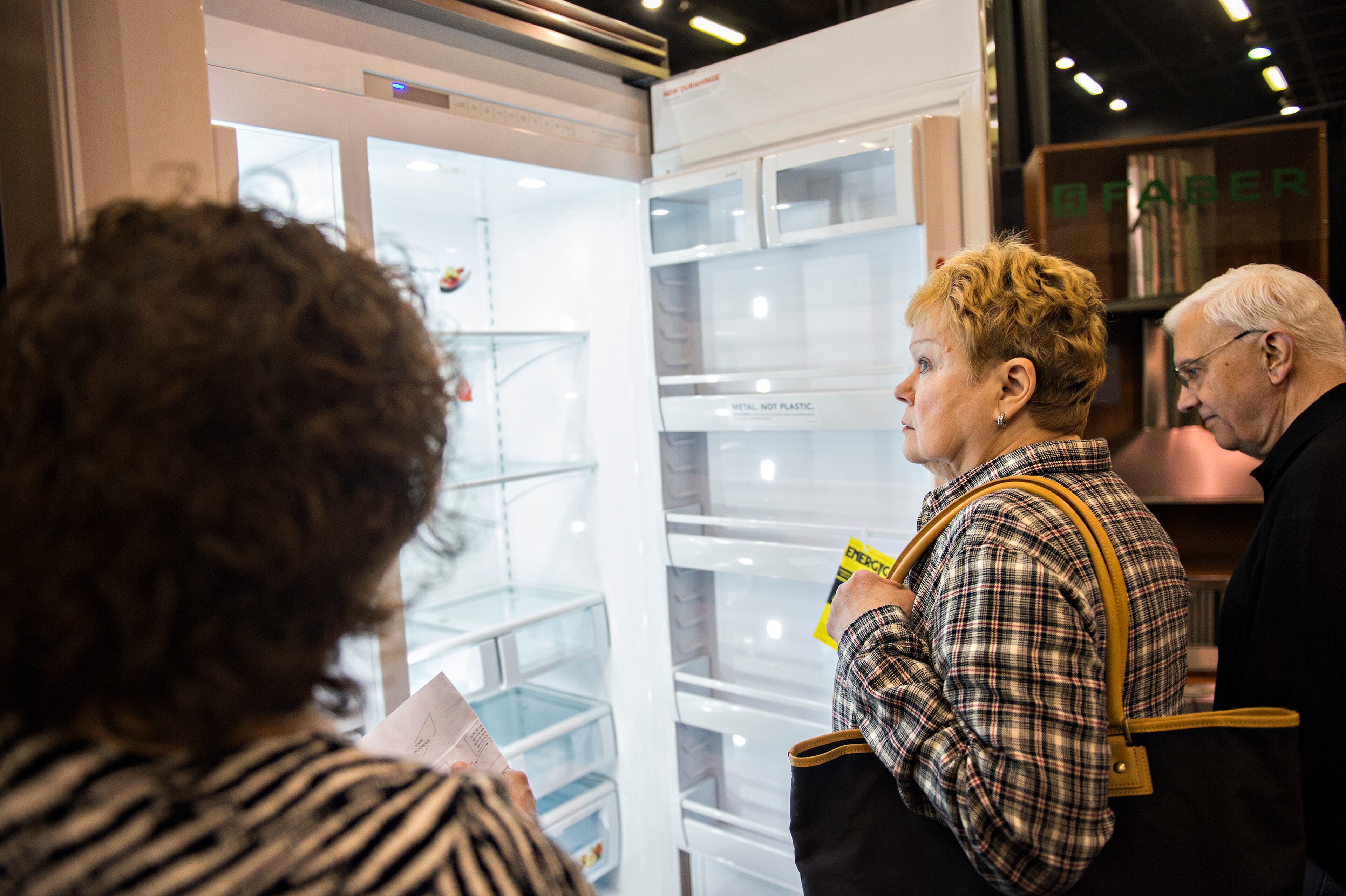 Brenda Driver (center) and her husband Brandy Davenport check out the inside of a Viking refrigerator display during the 37th annual Spring Atlanta Home Show at the Cobb Galleria Centre on March 22, 2015. The three-day show featured exhibits and seminars on landscaping and lawn care, kitchen appliances, fixtures, flooring, roofing, siding, concrete, windows, heating and air conditioning, patios and insulation. JONATHAN PHILLIPS / SPECIAL