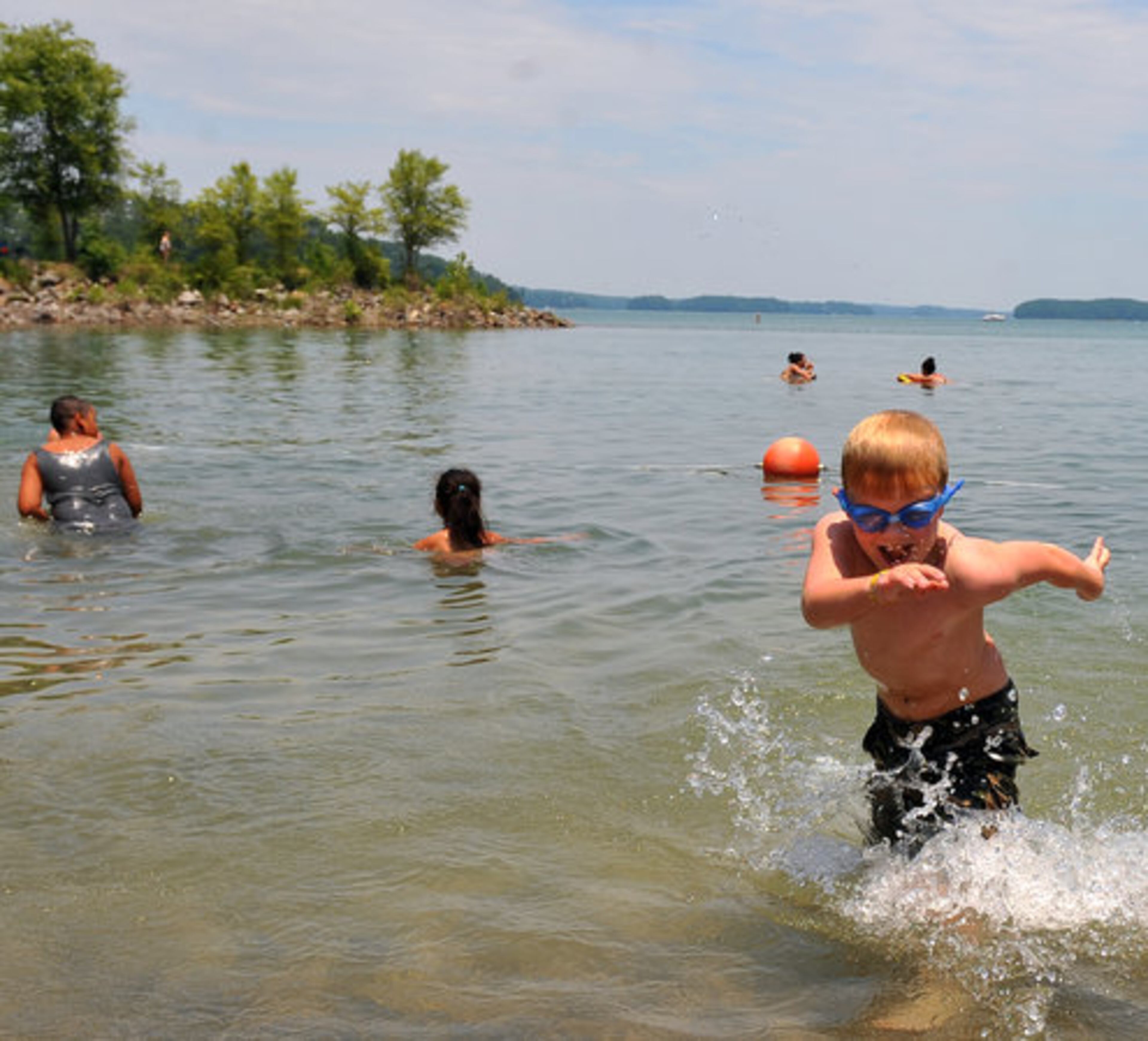 Charlie Smith, 6, races to shore at the the West Bank day use area.