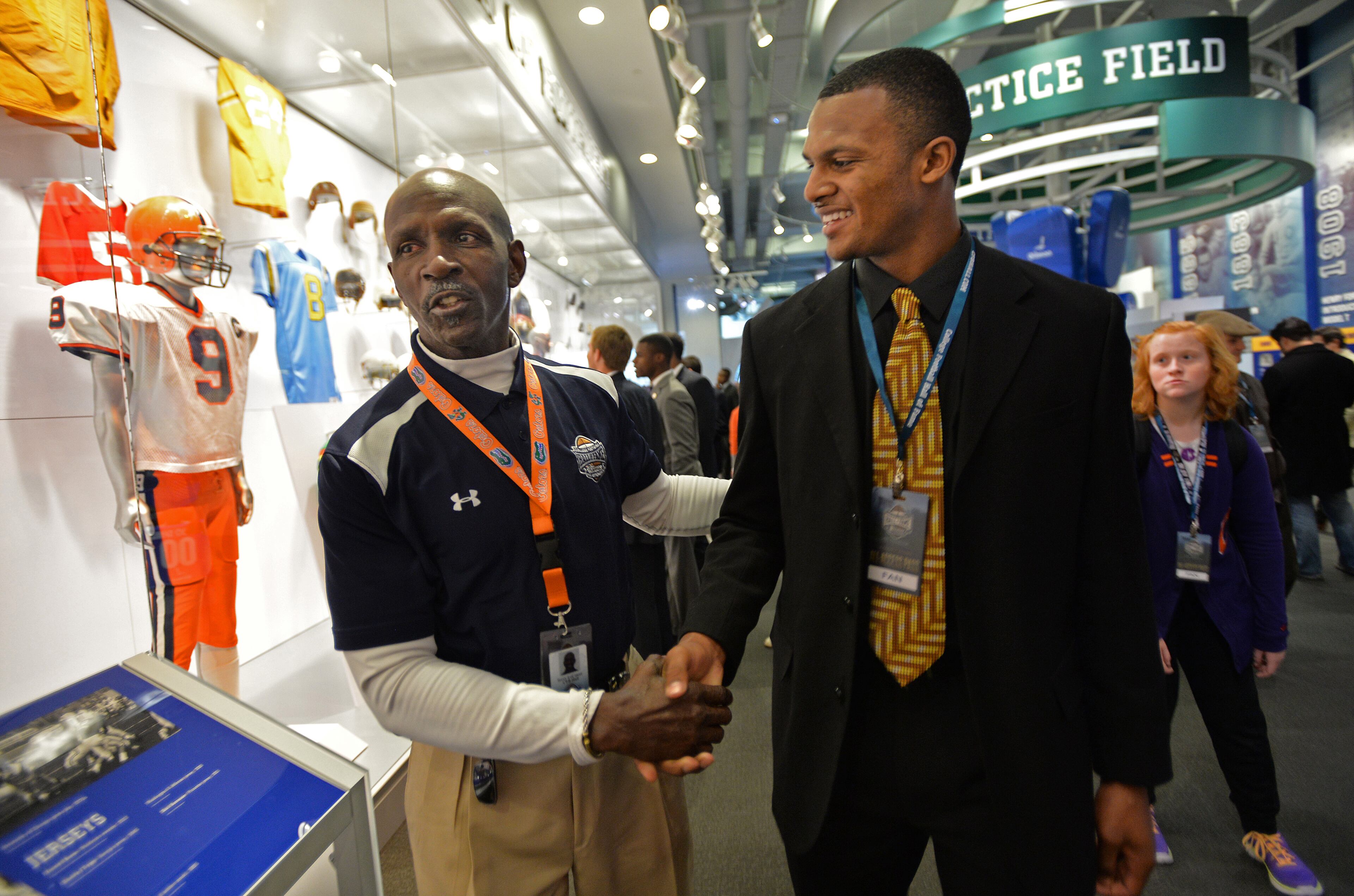 Former University of Florida quarterback and former NFL player Terry LeCount (left) chats with Clemson Tigers quarterback Deshaun Watson. HYOSUB SHIN / HSHIN@AJC.COM