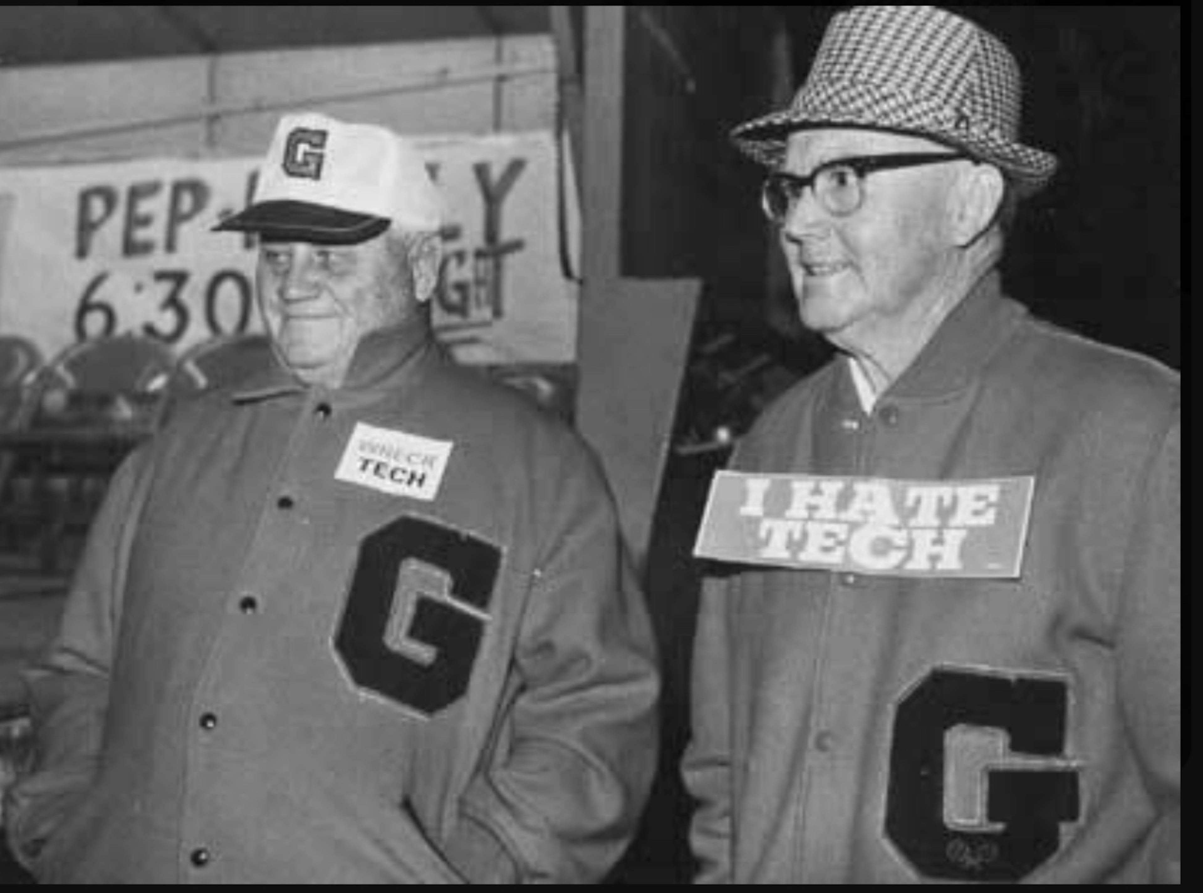 This shot of Bill Hartman (left) with fellow UGA legend Dan Magill (right) is “one of my favorites,” Hartman’s son said. (Hartman family)