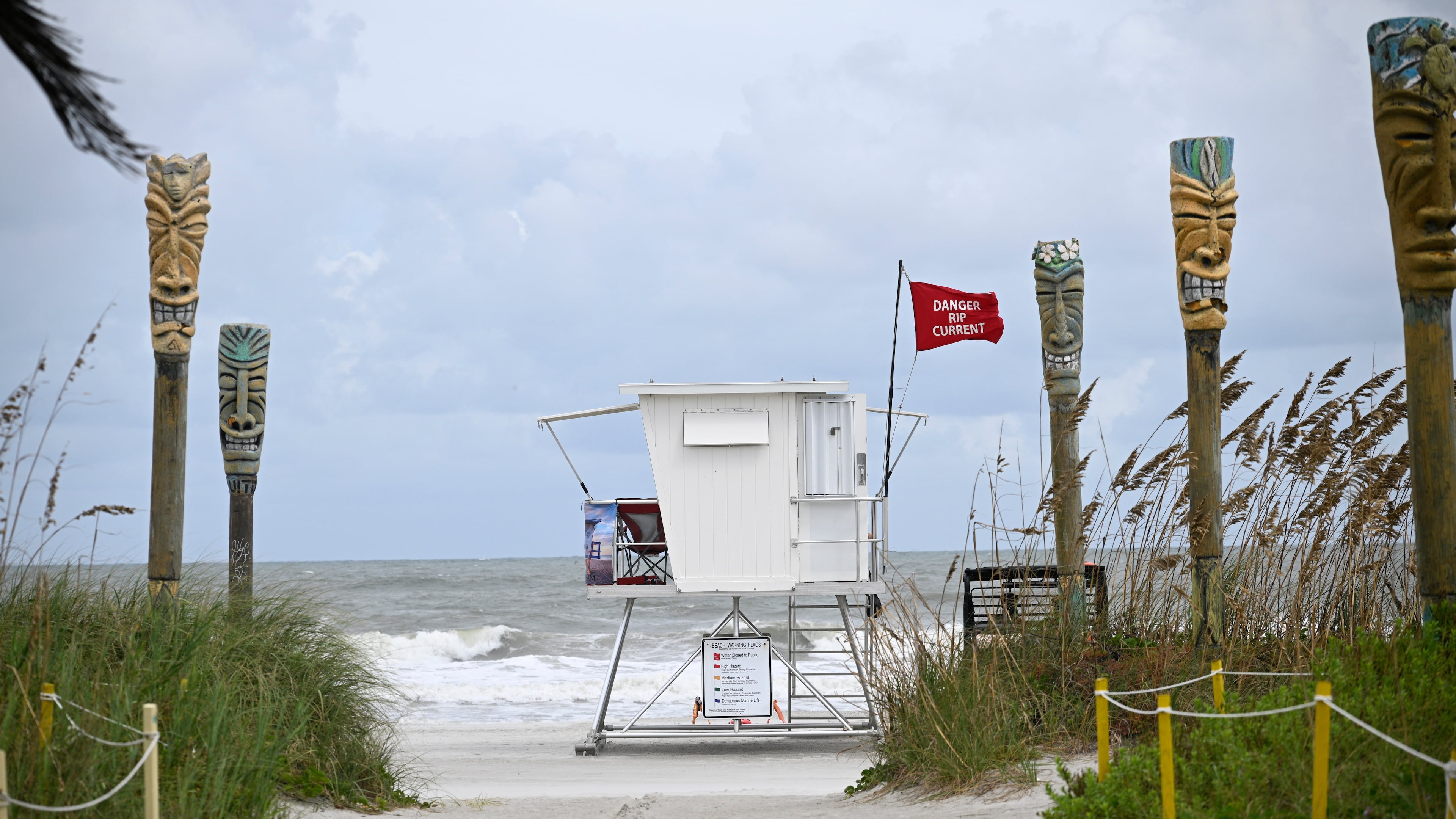 FILE - A "Danger Rip Current" flag flies as Tropical Storm Imelda passes offshore Sept. 29, 2025, in Cocoa Beach, Fla. (AP Photo/Phelan M. Ebenhack, File)