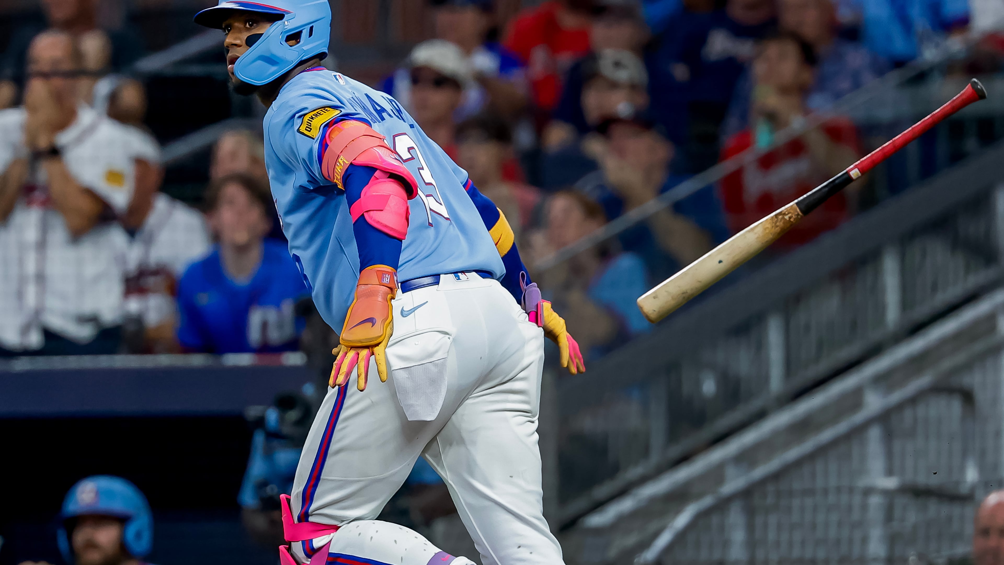 Atlanta Braves' Ronald Acuña Jr. (13) flips his bat after hitting a solo home run against the Philadelphia Phillies during the fourth inning of a baseball game, Saturday, Sept. 12, 2026, in Atlanta. (AP Photo/Erik S. Lesser)