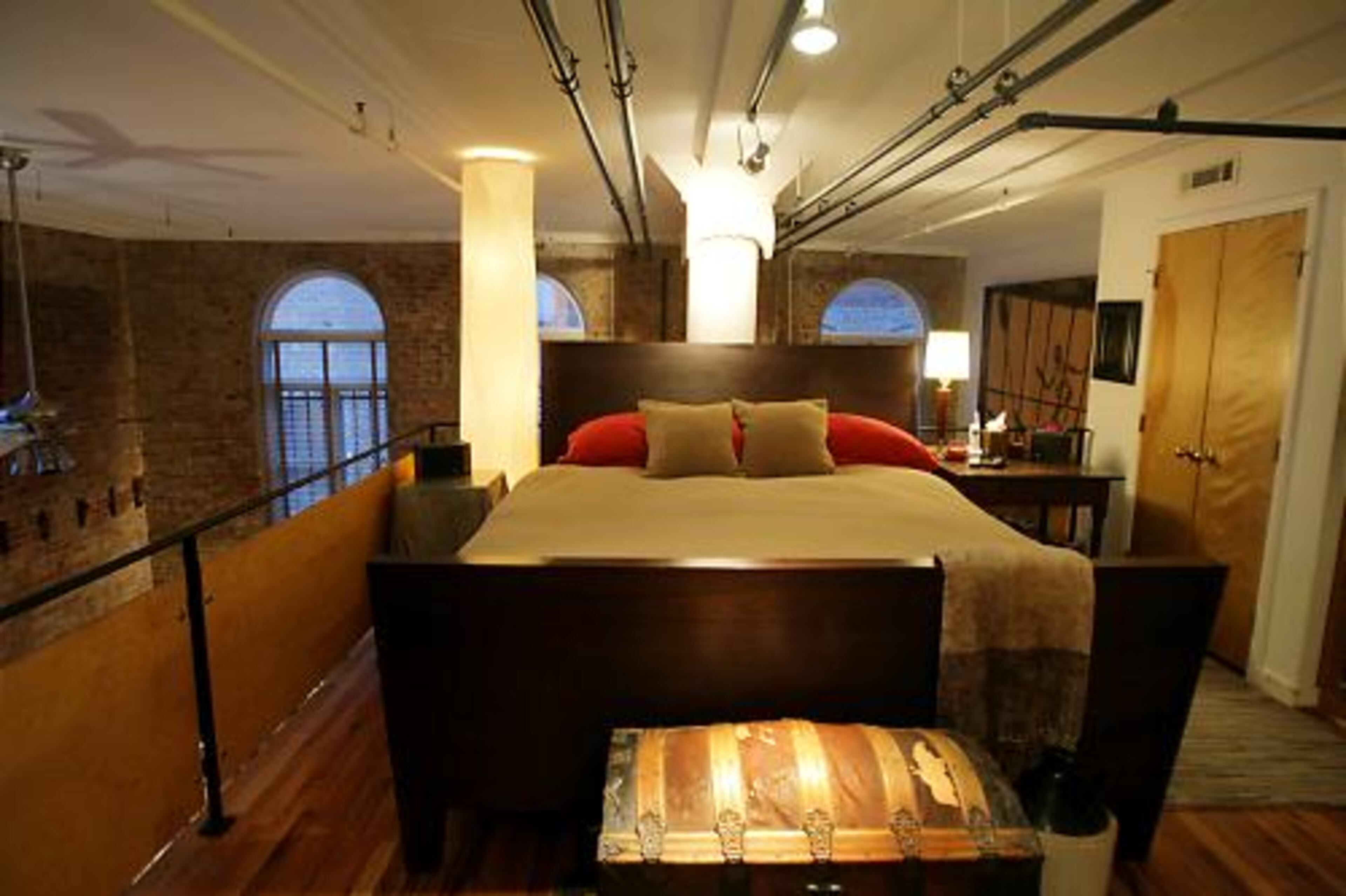 Jones keeps his style in the master bedroom simple. His grandmother was an antiques dealer, and he grew up around her trade. Many of his furnishings, including this trunk, came from her home in North Carolina.
