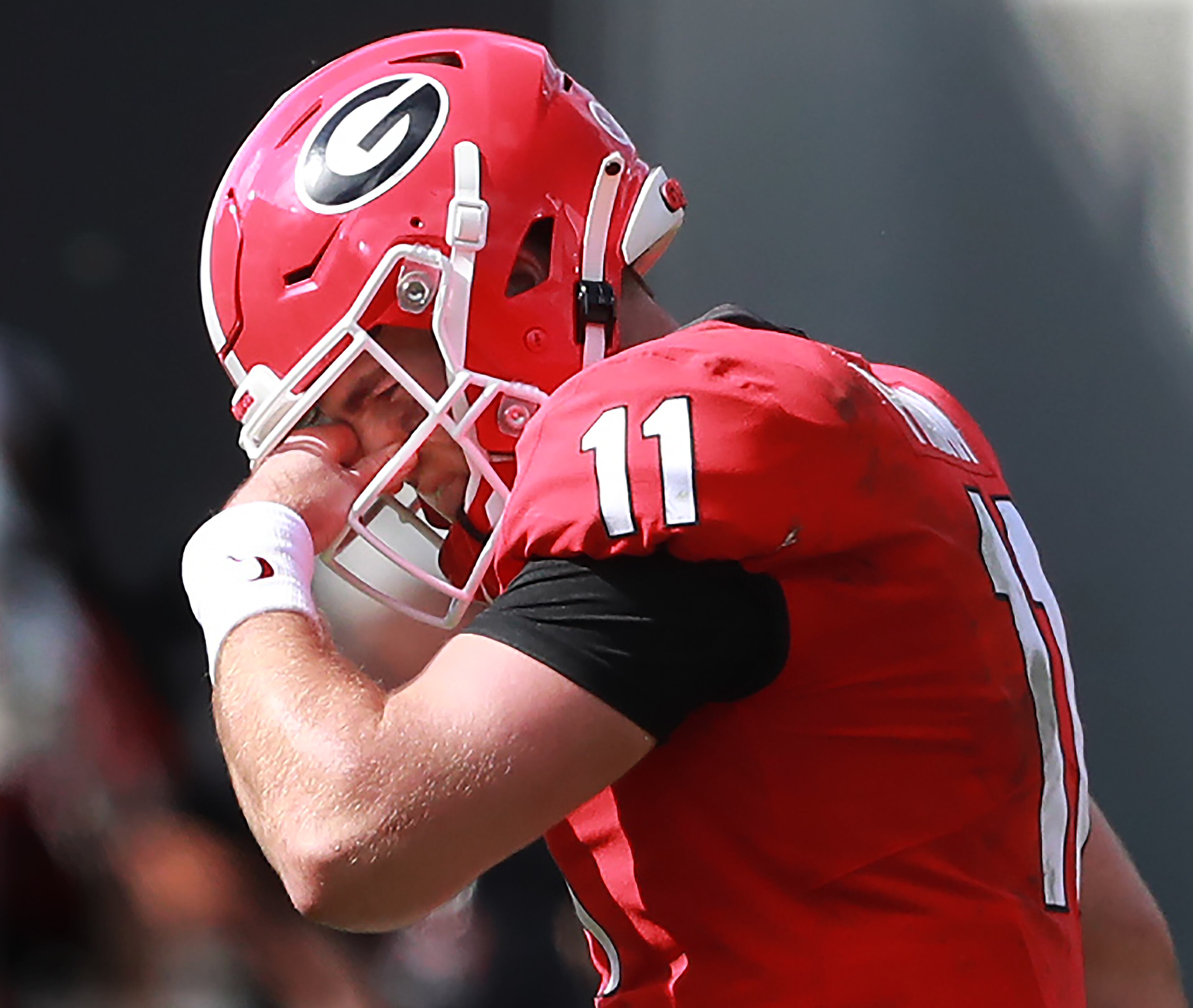 Georgia quarterback Jake Fromm holds his nose as he walks off the field after he was intercepted by South Carolina defensive back Israel Mukuamu during the fourth quarter. Curtis Compton/ccompton@ajc.com