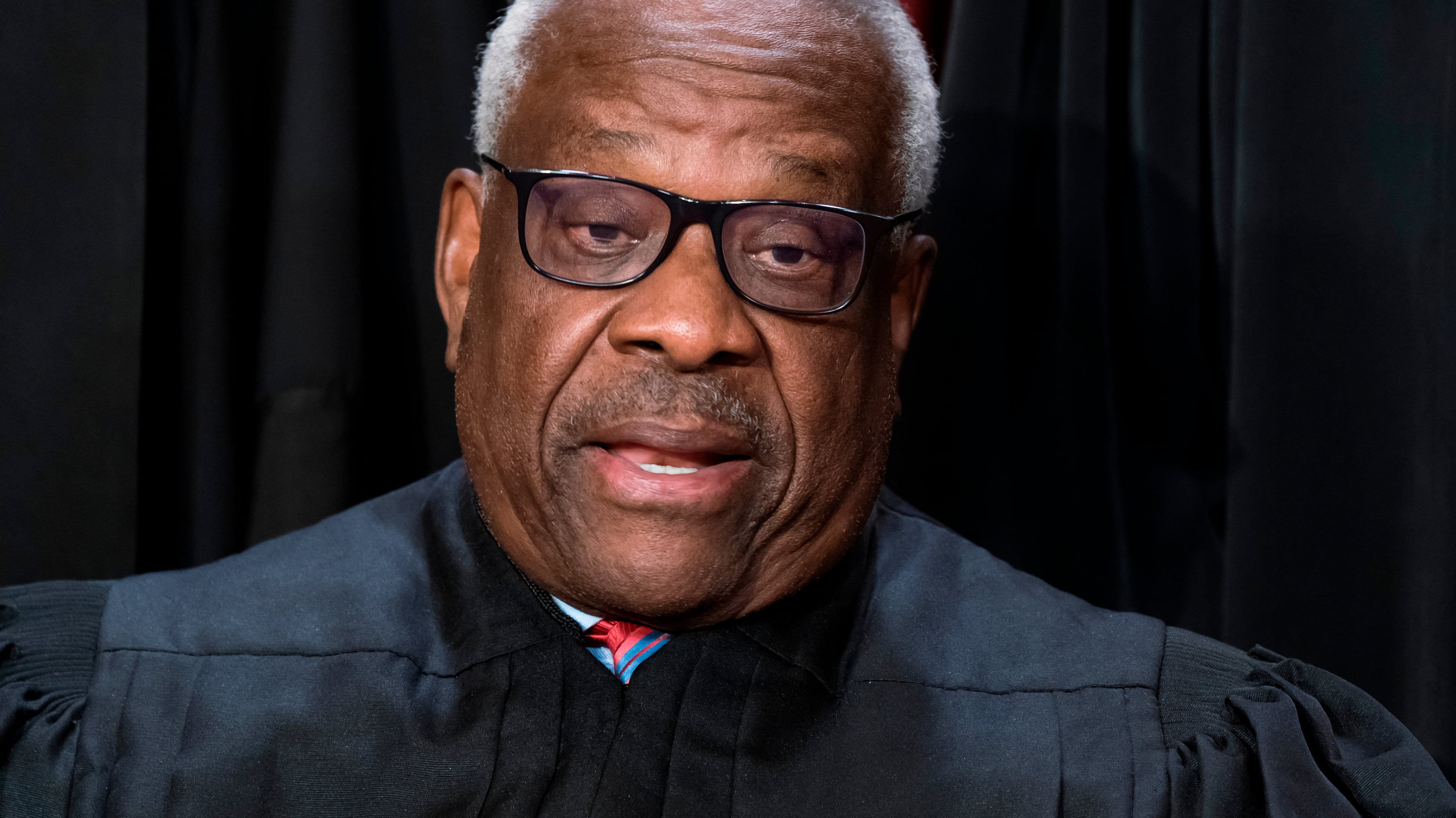 FILE - Supreme Court Associate Justice Clarence Thomas joins other members of the Supreme Court as they pose for a new group portrait, at the Supreme Court building in Washington, Oct. 7, 2022. Thomas was nominated by President George H. W. Bush to succeed Justice Thurgood Marshall and has served since 1991. (AP Photo/J. Scott Applewhite, File)