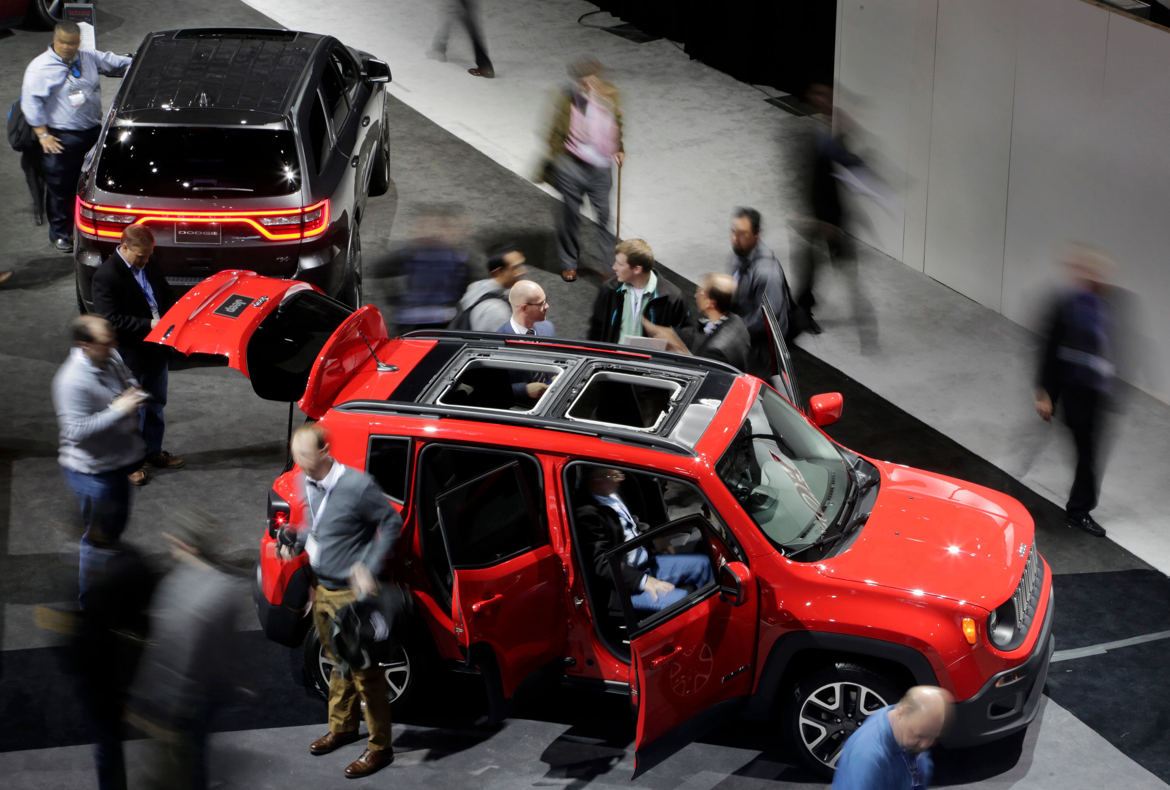 FILE - This April 17, 2014 file photo shows the 2015 Jeep Renegade at the New York International Auto Show, in New York. Subcompact Fiat-based SUV hits showrooms early next year, but Chrysler sales execs are wishing they had it now as small SUV sales soar. It looks like a classic Jeep with a vertical grille and round headlamps. (AP Photo/Mark Lennihan, file)