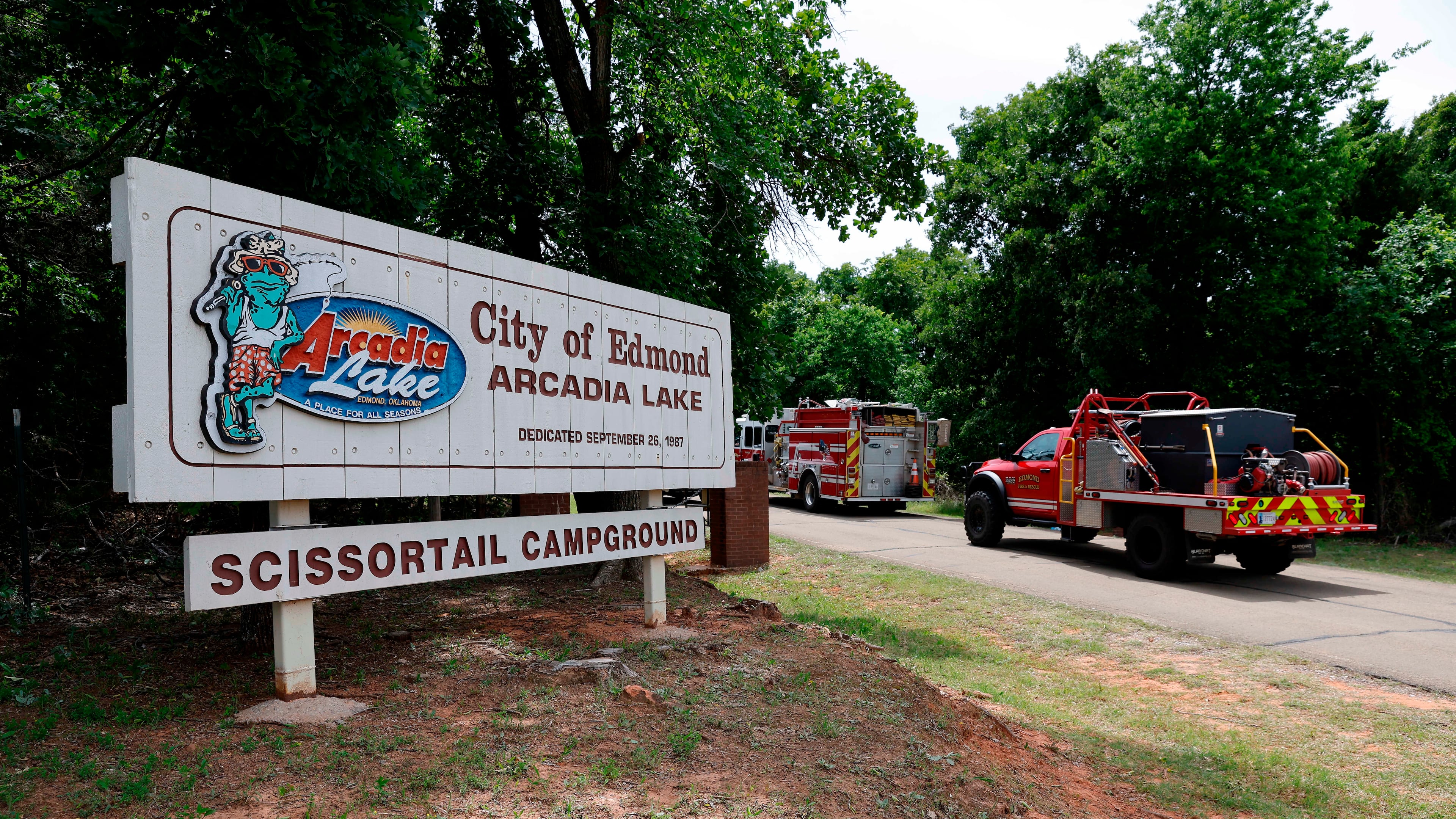 Edmond fire crews enter Scissortail Campground at Arcadia Lake in Edmond, Okla. on Monday, May 4, 2026 after a party shooting on Sunday evening. (AP Photo/Alonzo Adams)