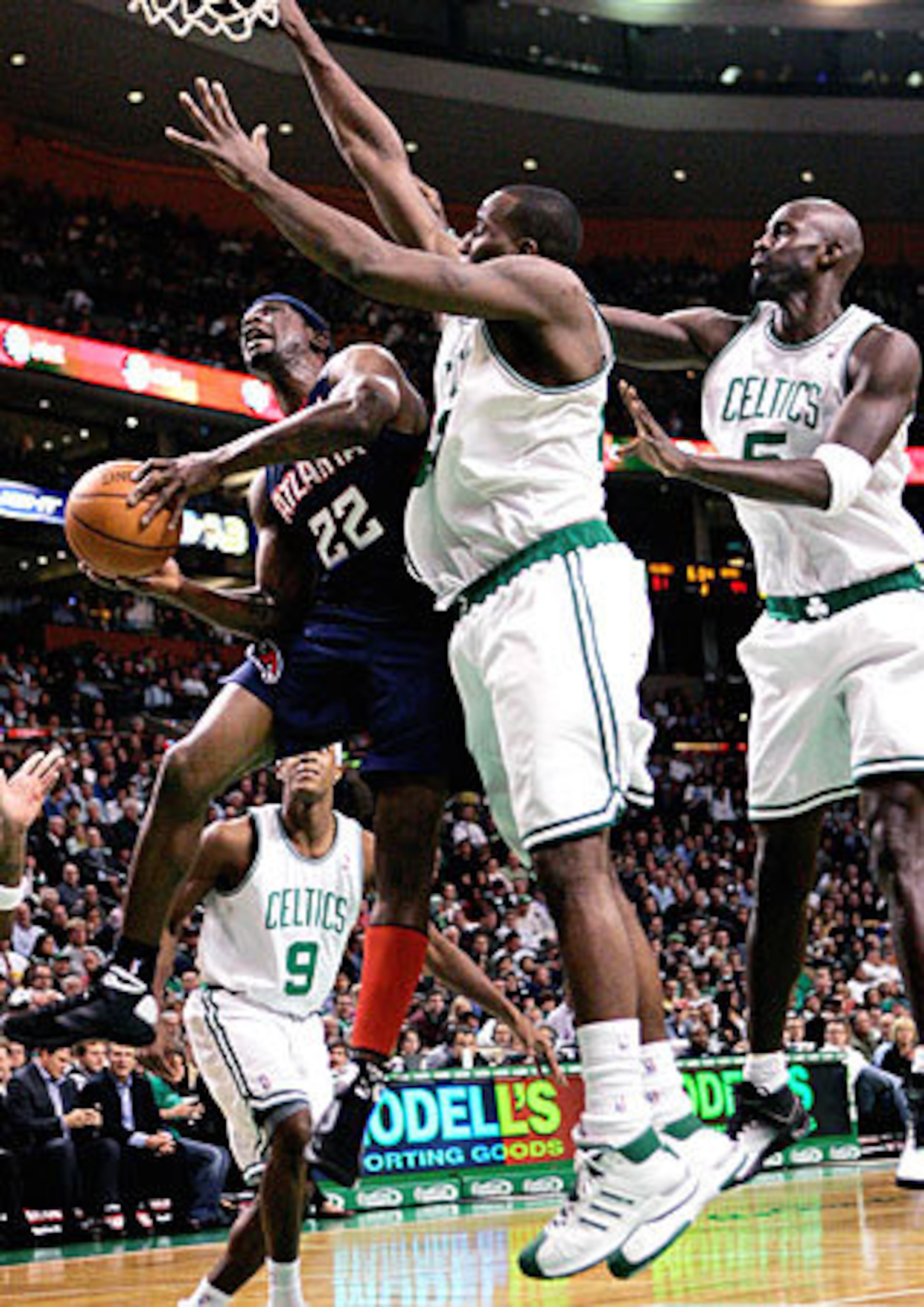 Hawks' guard Ronald "Flip" Murray had it going in the first half and helped Atlanta take a 16-point lead over Kendrick Perkins (center), Kevin Garnett (right) and the Celtics.