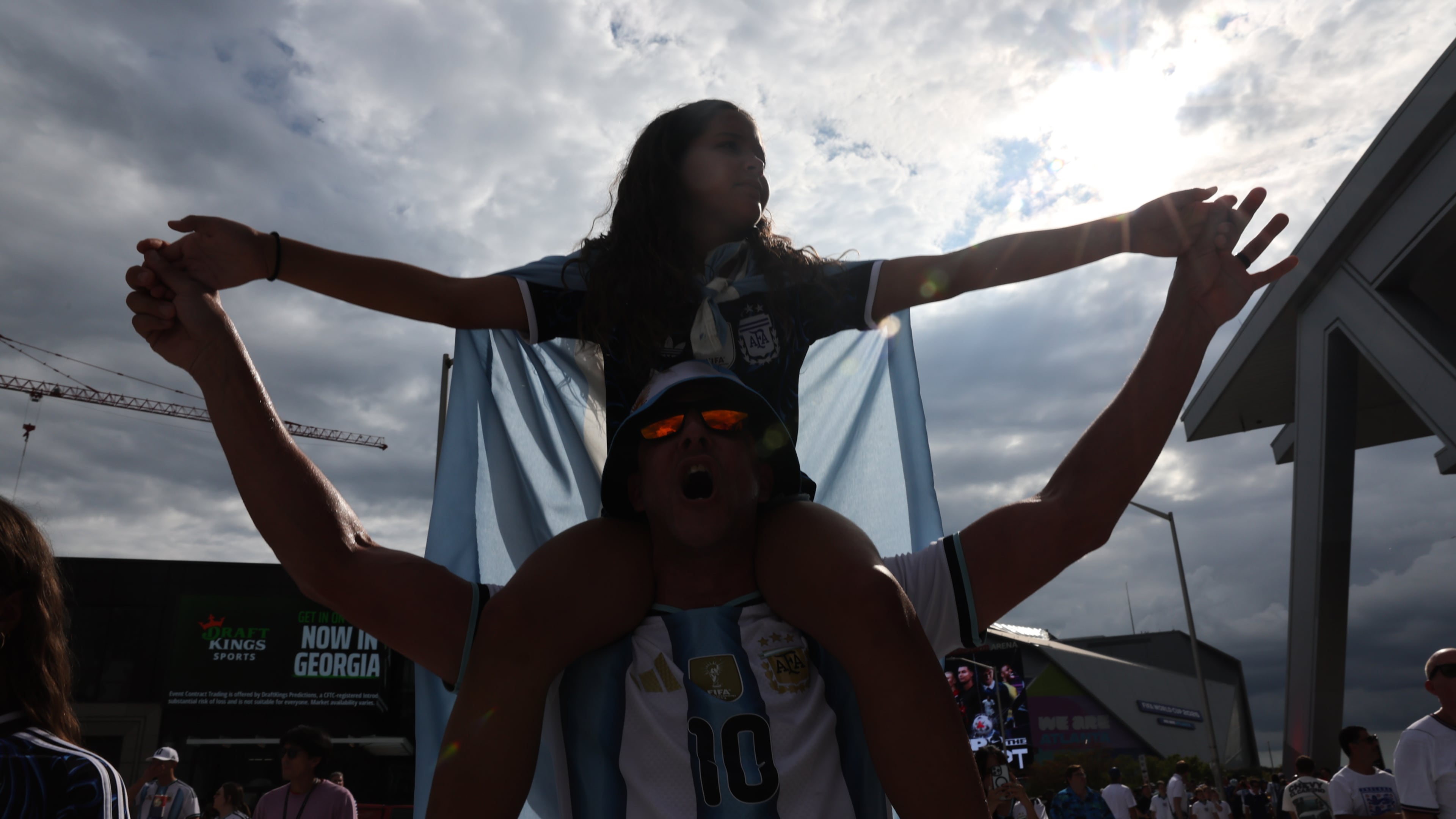 Argentina fans celebrate outside Atlanta Stadium (Mercedes-Benz Stadium) after Argentina wins the FIFA World Cup game between England and Argentina in Atlanta on July 15, 2026. The World Cup brought the world to Atlanta, while giving Nedra Rhone the perfect vehicle for a staycation. (Arvin Temkar/AJC)