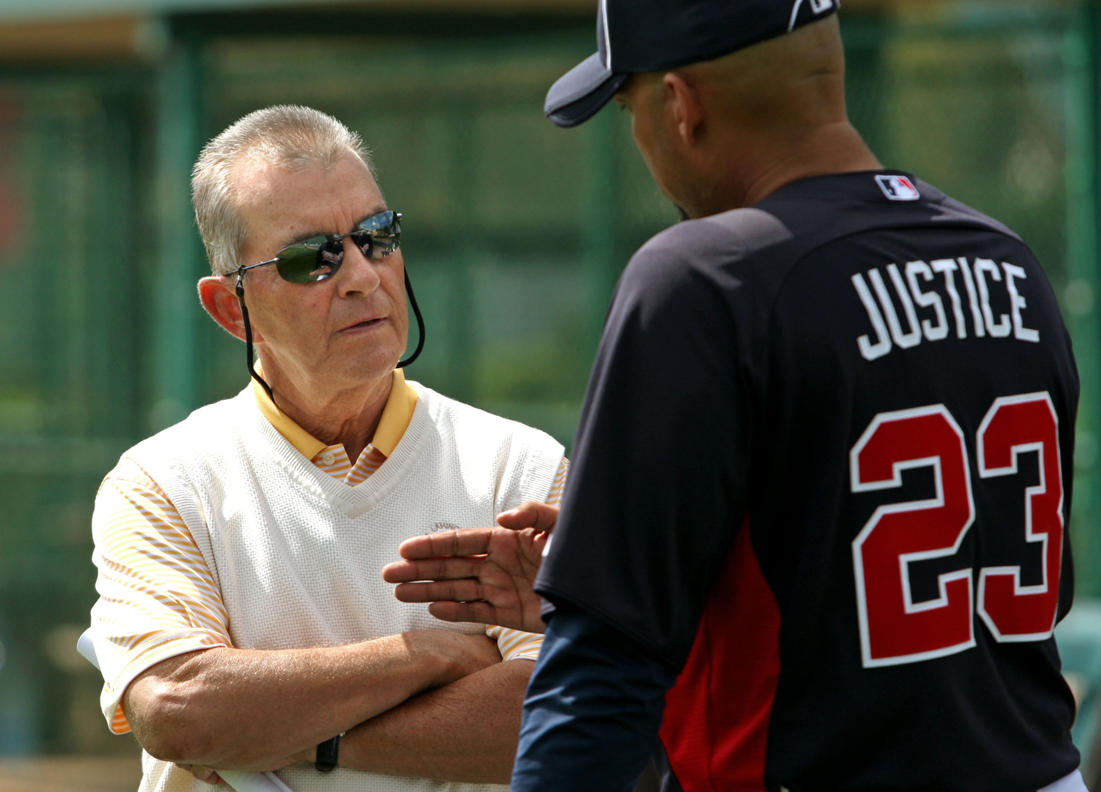Braves GM John Schuerholz (left) says trading David Justice (right) was his hardest move.