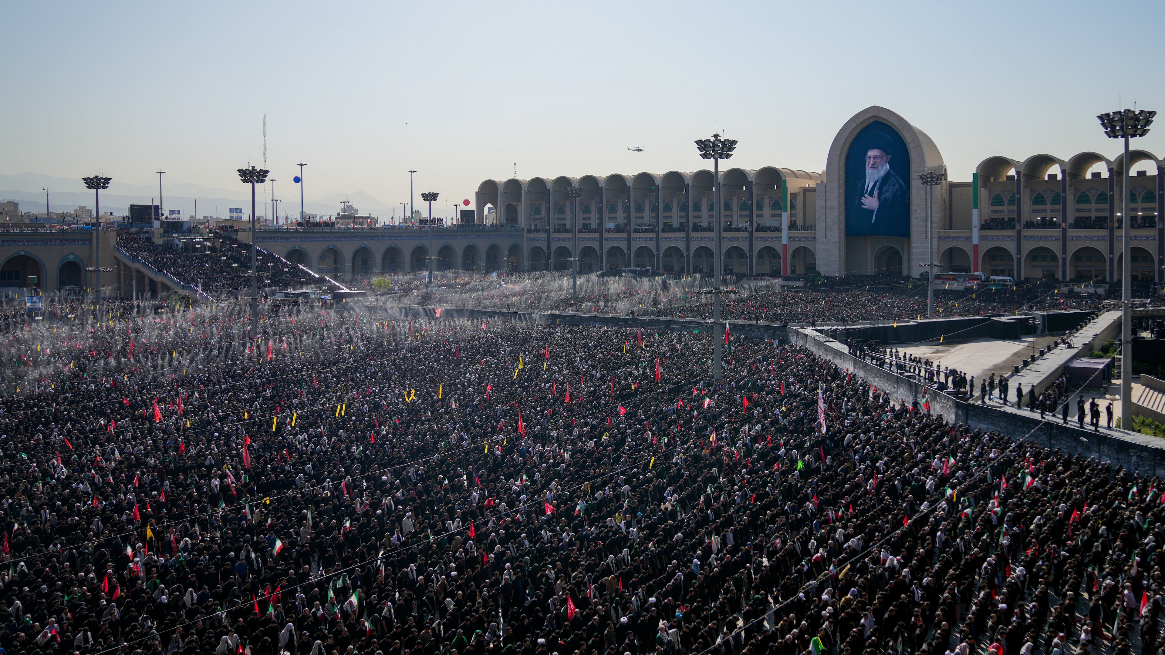 Mourners pray during funeral prayers held as part of the dayslong funeral ceremonies for the slain Iranian Supreme Leader Ayatollah Ali Khamenei and members of his family at the Imam Khomeini Mosalla Grand Mosque in Tehran, Iran, Sunday, July 5, 2026. (AP Photo/Altaf Qadri)