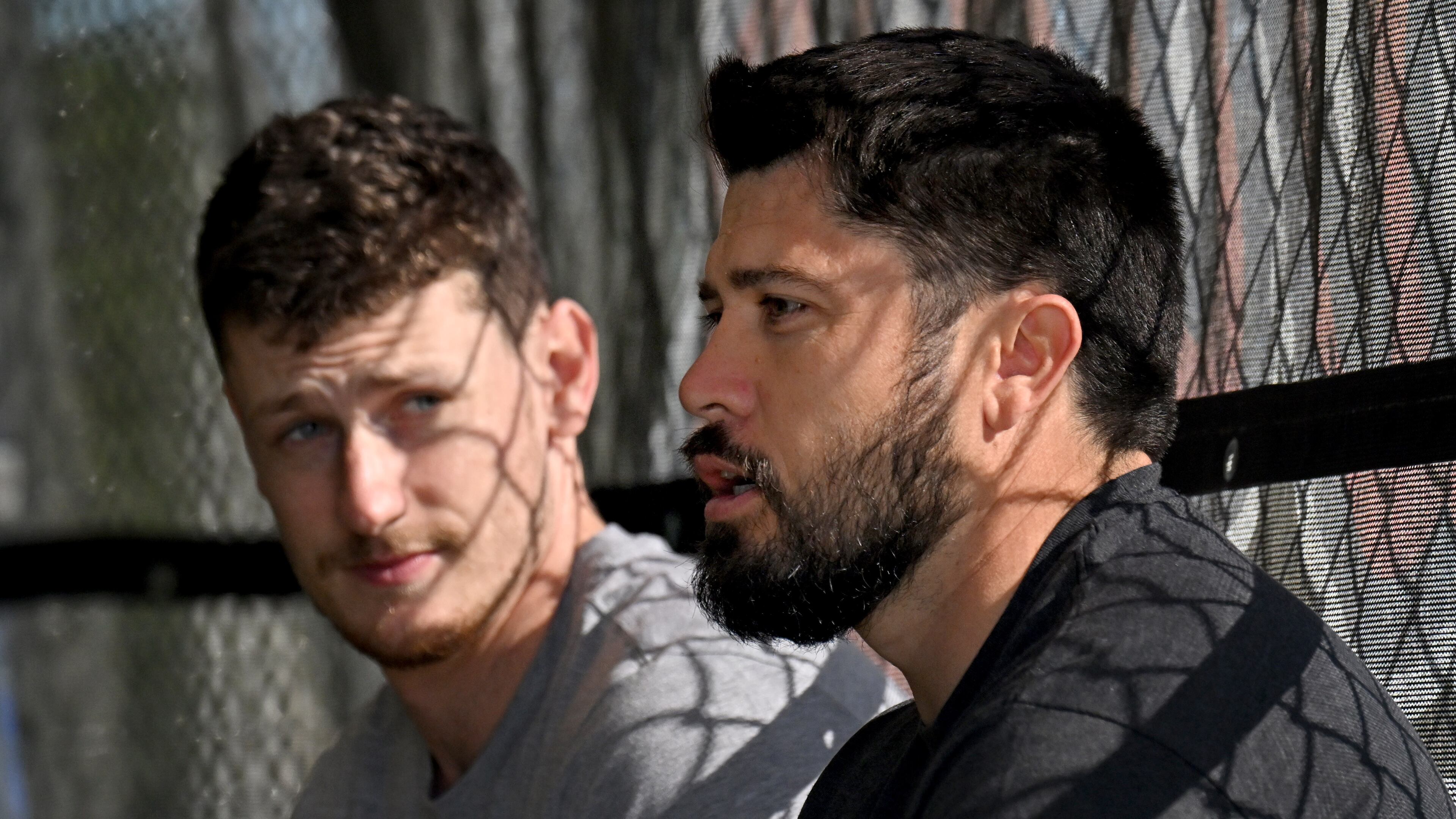 Atlanta Braves catcher Sean Murphy (left) and Travis d'Arnaud chat while taking batting practice during spring training baseball workouts at CoolToday Park, Wednesday, February, 14, 2024, in North Port, Florida. (Hyosub Shin / Hyosub.Shin@ajc.com)