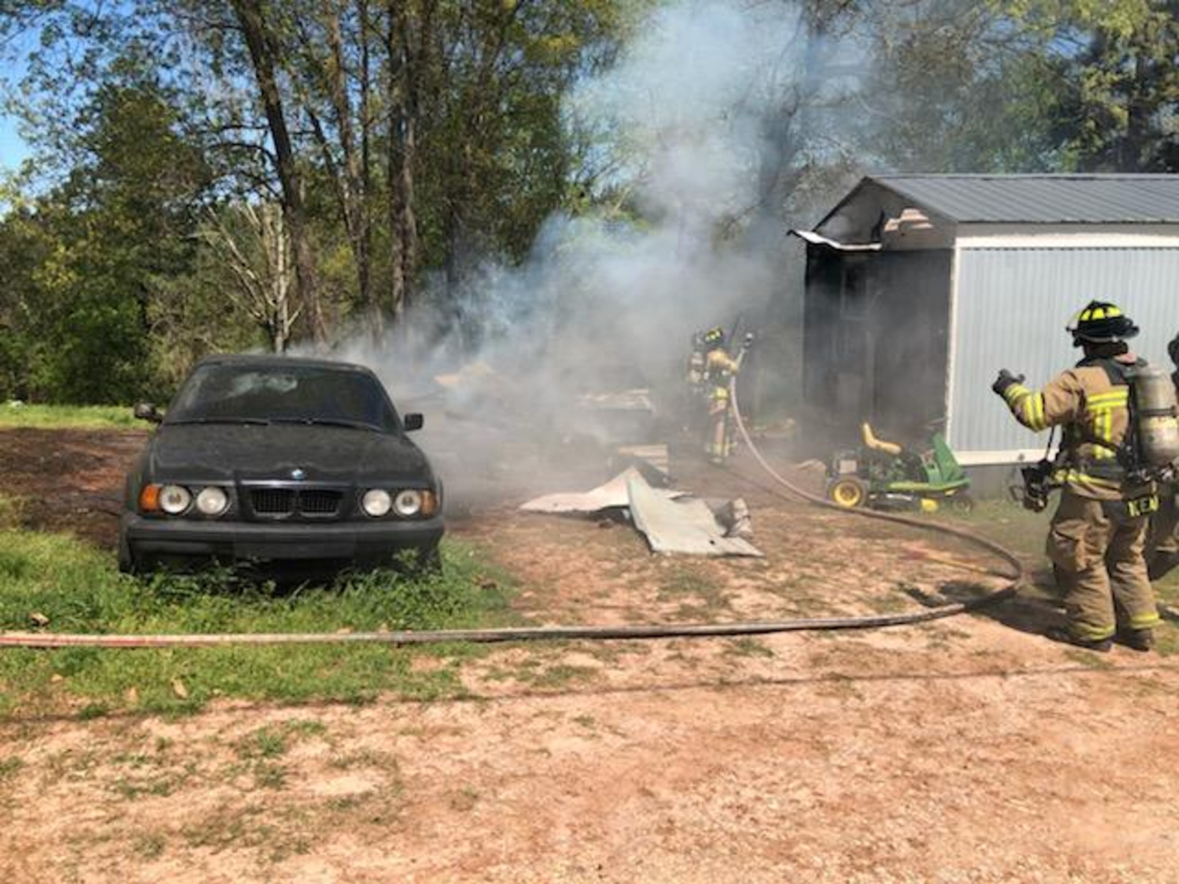 This outbuilding was engulfed in flames when crews arrived on the scene Thursday.