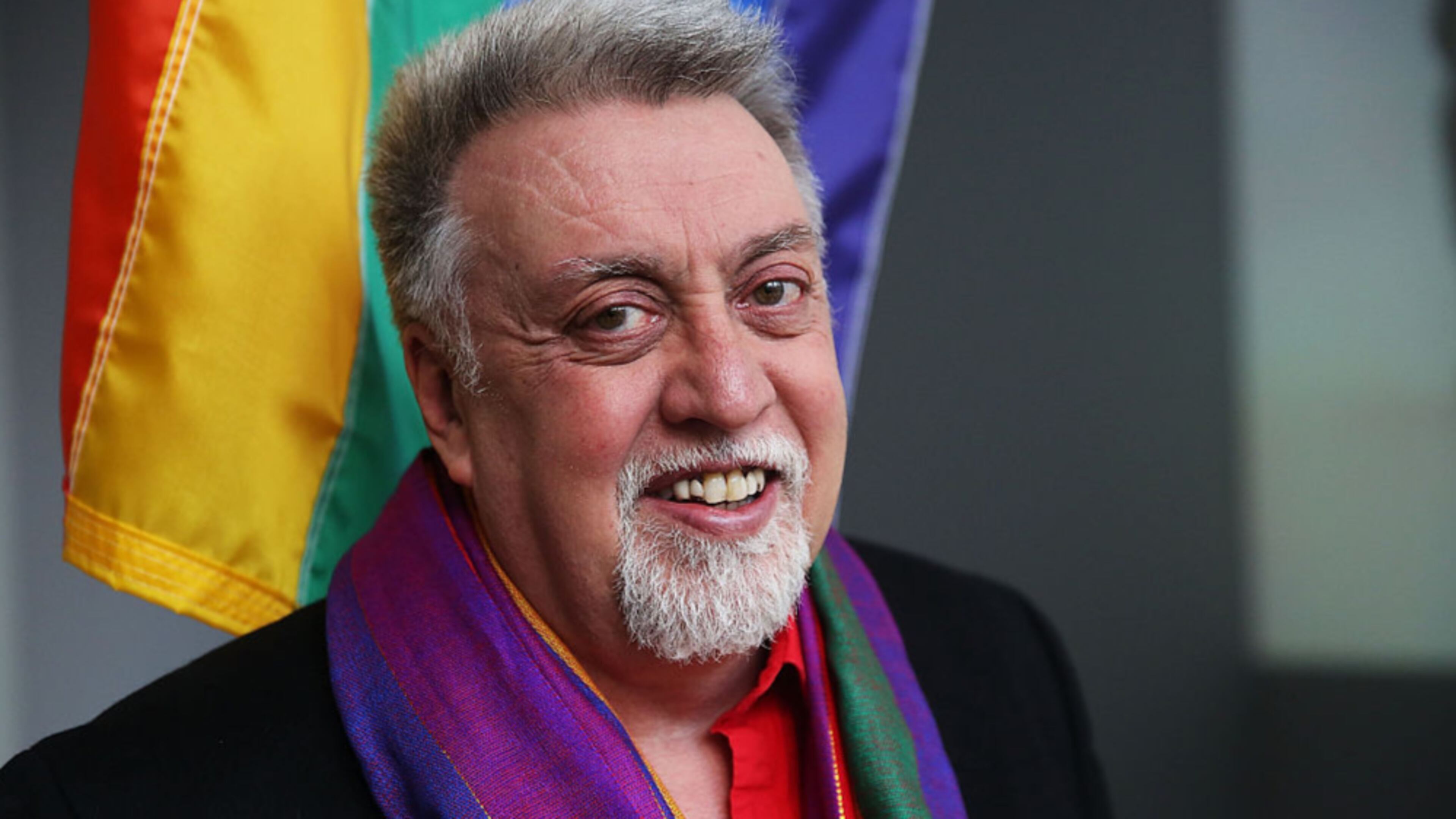 NEW YORK, NY - JANUARY 07: Rainbow Flag Creator Gilbert Baker poses at the Museum of Modern Art (MoMA) on January 7, 2016 in New York City. MoMa announced in June 2015 its acquisition of the iconic Rainbow Flag into the design collection. Baker, an openly gay artist and civil rights activist, designed the Rainbow Flag in 1978. The flag has since become a prominent symbol to the gay community around the world. (Photo by Spencer Platt/Getty Images)