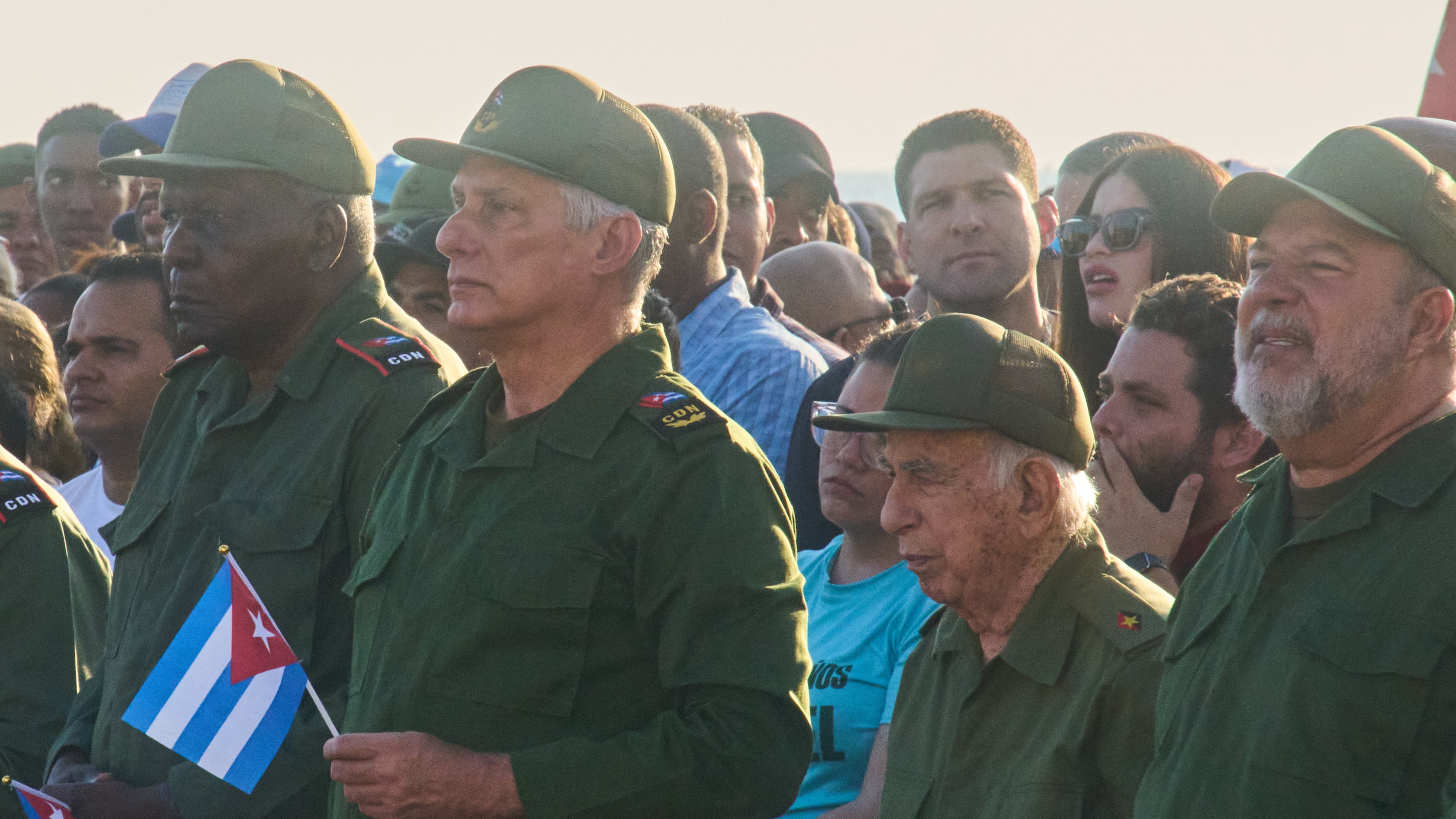 Cuba's President Miguel Diaz-Canel, second left, and Raul Castro's grandson Raul Guillermo Rodriguez Castro, center back, take part in a rally in support of former President Raul Castro in front of the U.S. Embassy in Havana, Cuba, Friday, May 22, 2026, after U.S. prosecutors filed an indictment accusing him of ordering the 1996 shootdown of civilian planes flown by Miami-based exiles. (AP Photo/Ramon Espinosa)