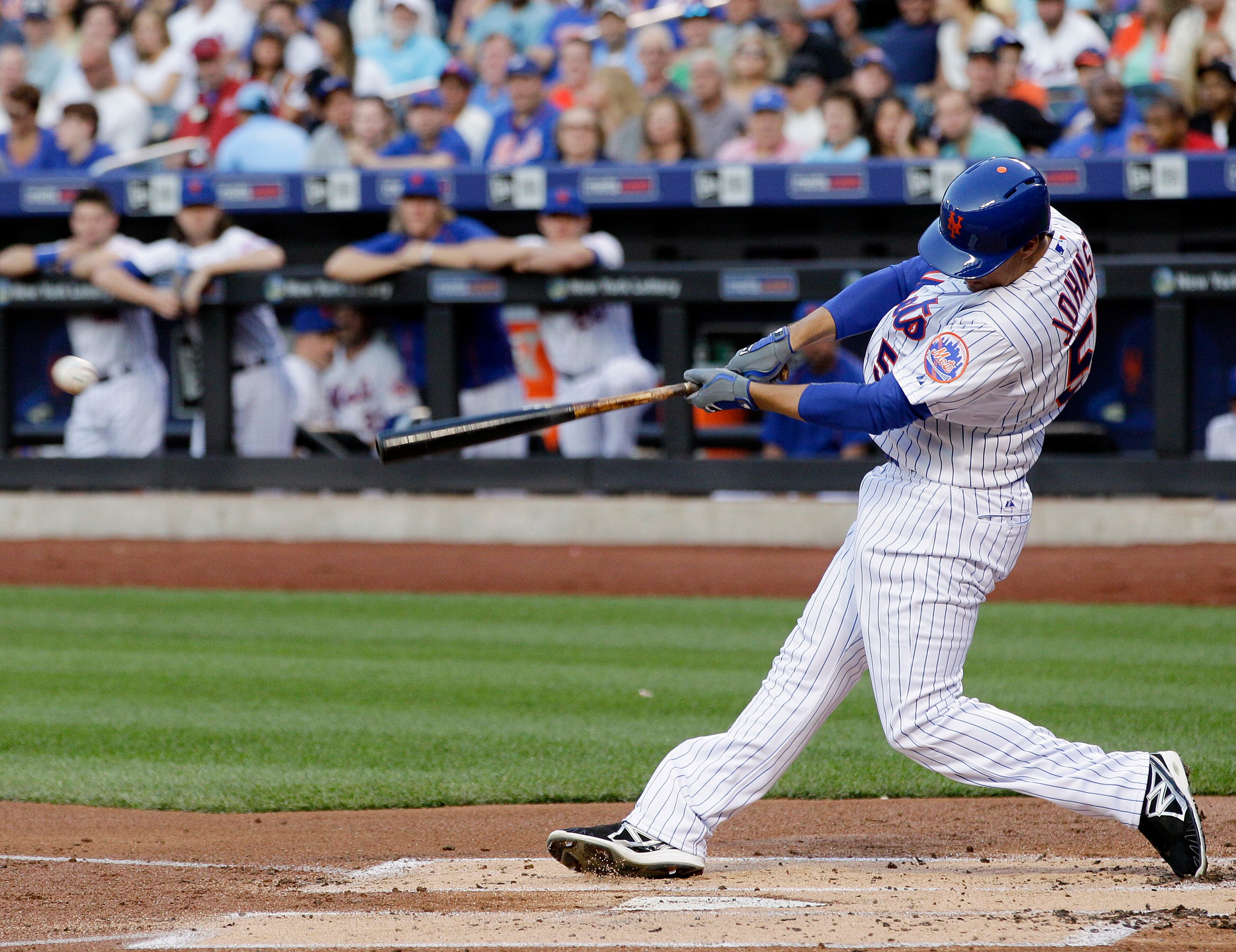 New York Mets' Kelly Johnson hits a single during the first inning of a baseball game against the Los Angeles Dodgers, Saturday, July 25, 2015, in New York. (AP Photo/Frank Franklin II)
