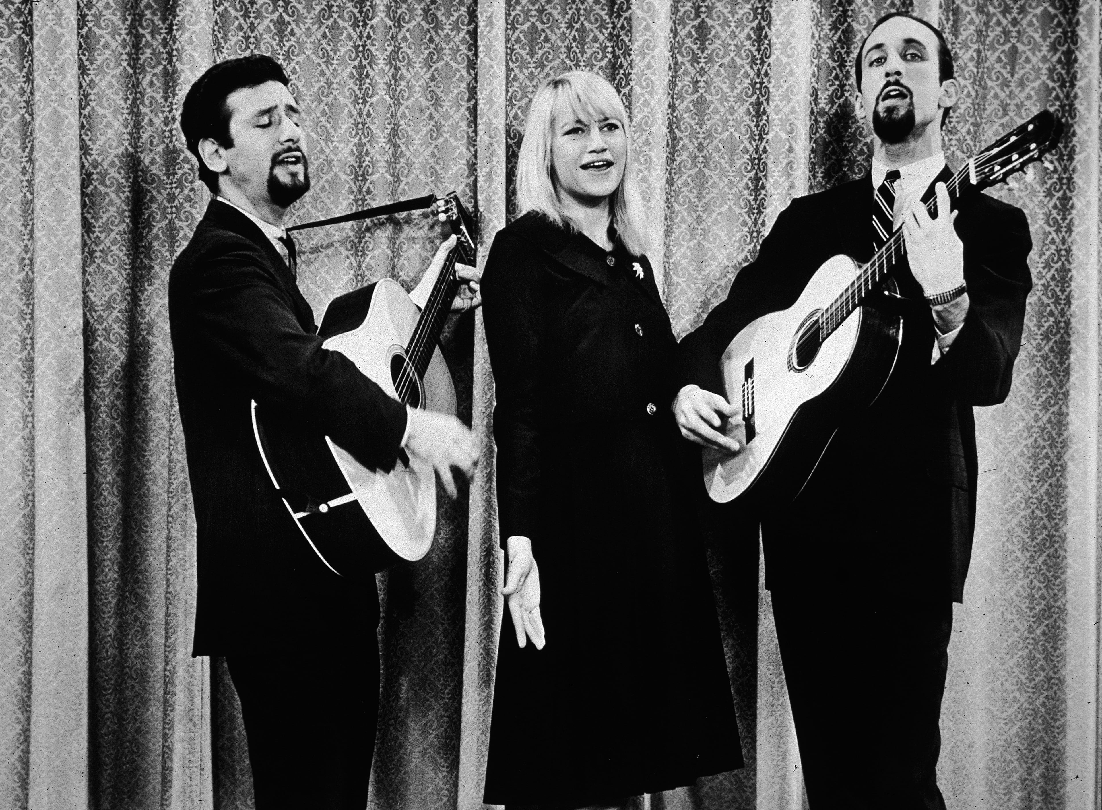 Portrait of the American singing group Peter (Yarrow), Paul (Stookey) and Mary (Travers) on "The Jack Benny Program," circa 1963. They sang on the Mall in Washington and had top hits on the charts at the time. (Photo by Hulton Archive/Getty Images)