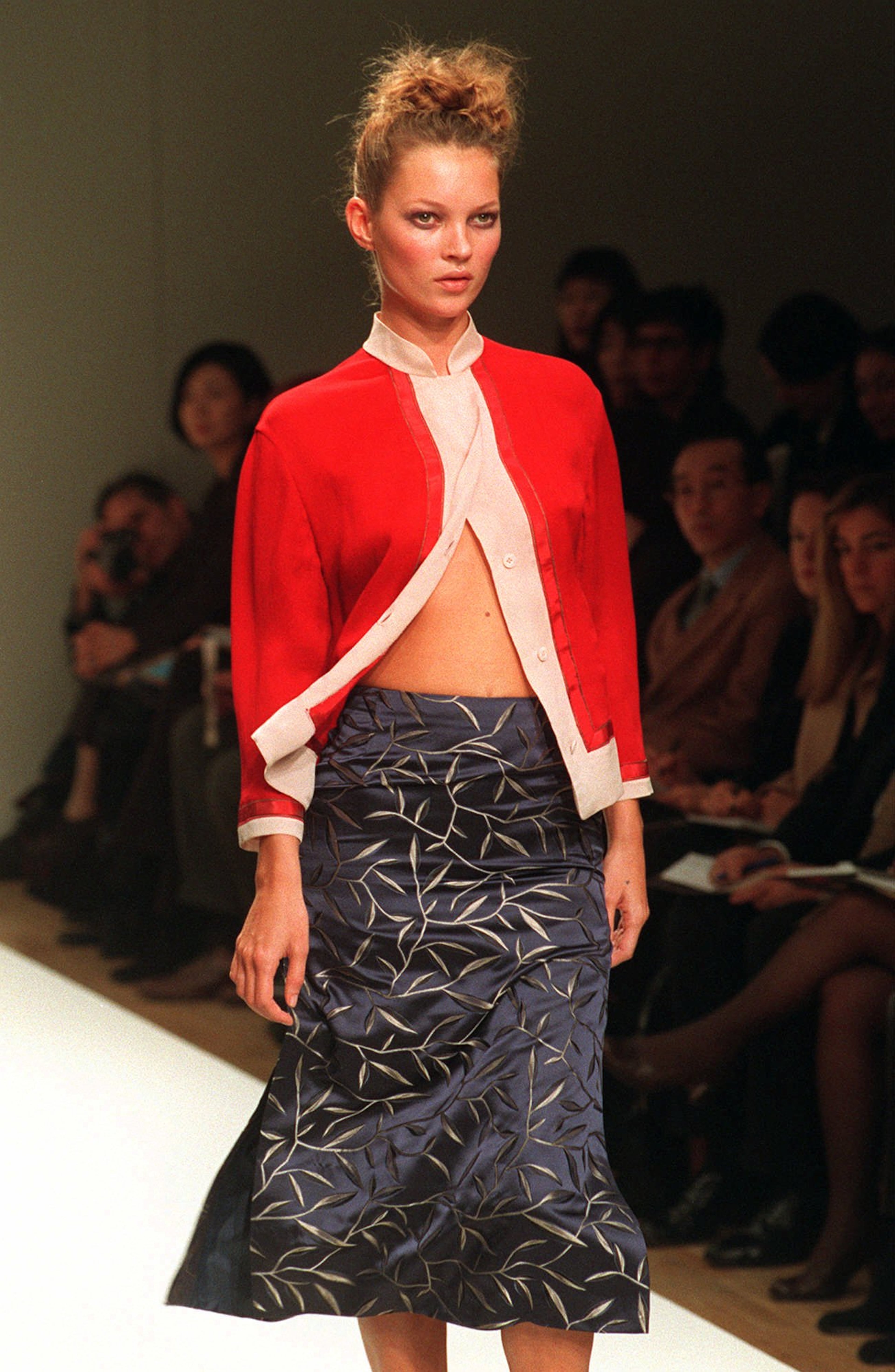 British model Kate Moss wears a model by Italian stylist Miuccia Prada at the unveiling of her ready-to-wear collection for the Spring-Summer 1997 in Milan Tuesday, October 1st, 1996.