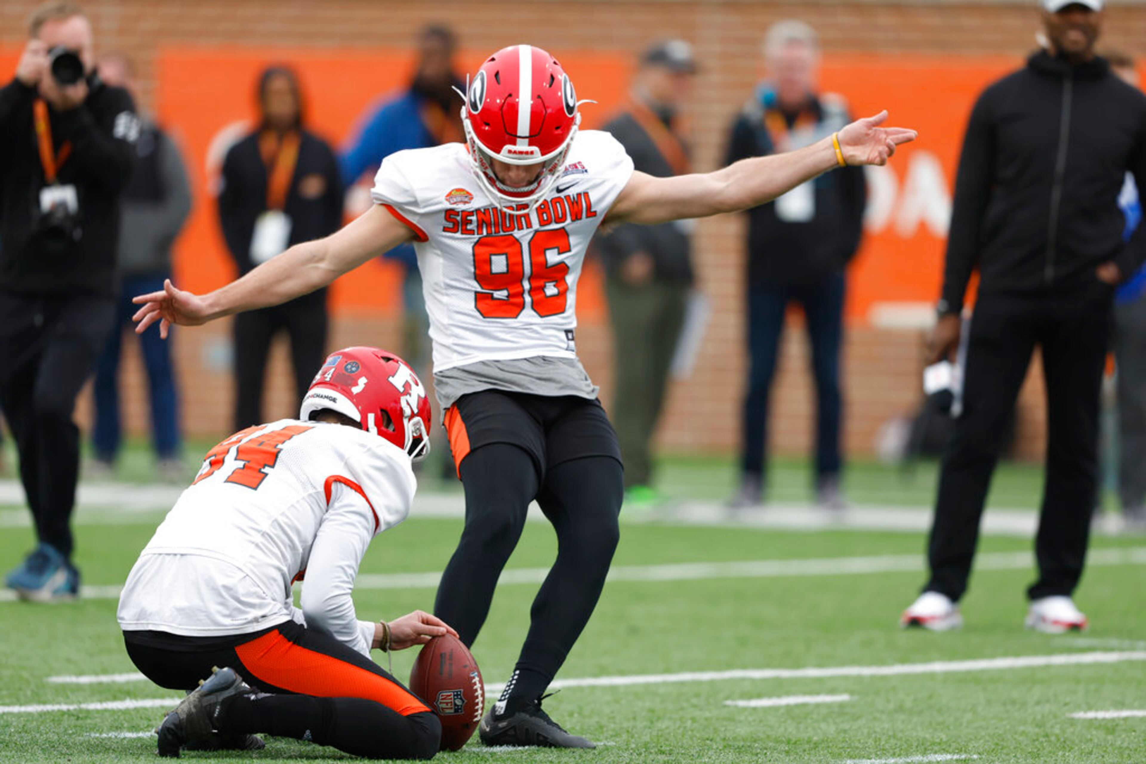 American place kicker Jack Podlesny of Georgia (96) and American Adam Korsak of Rutgers (94) run through drills during practice for the Senior Bowl NCAA college football game Thursday, Feb. 2, 2023, in Mobile, Ala.. (AP Photo/Butch Dill)