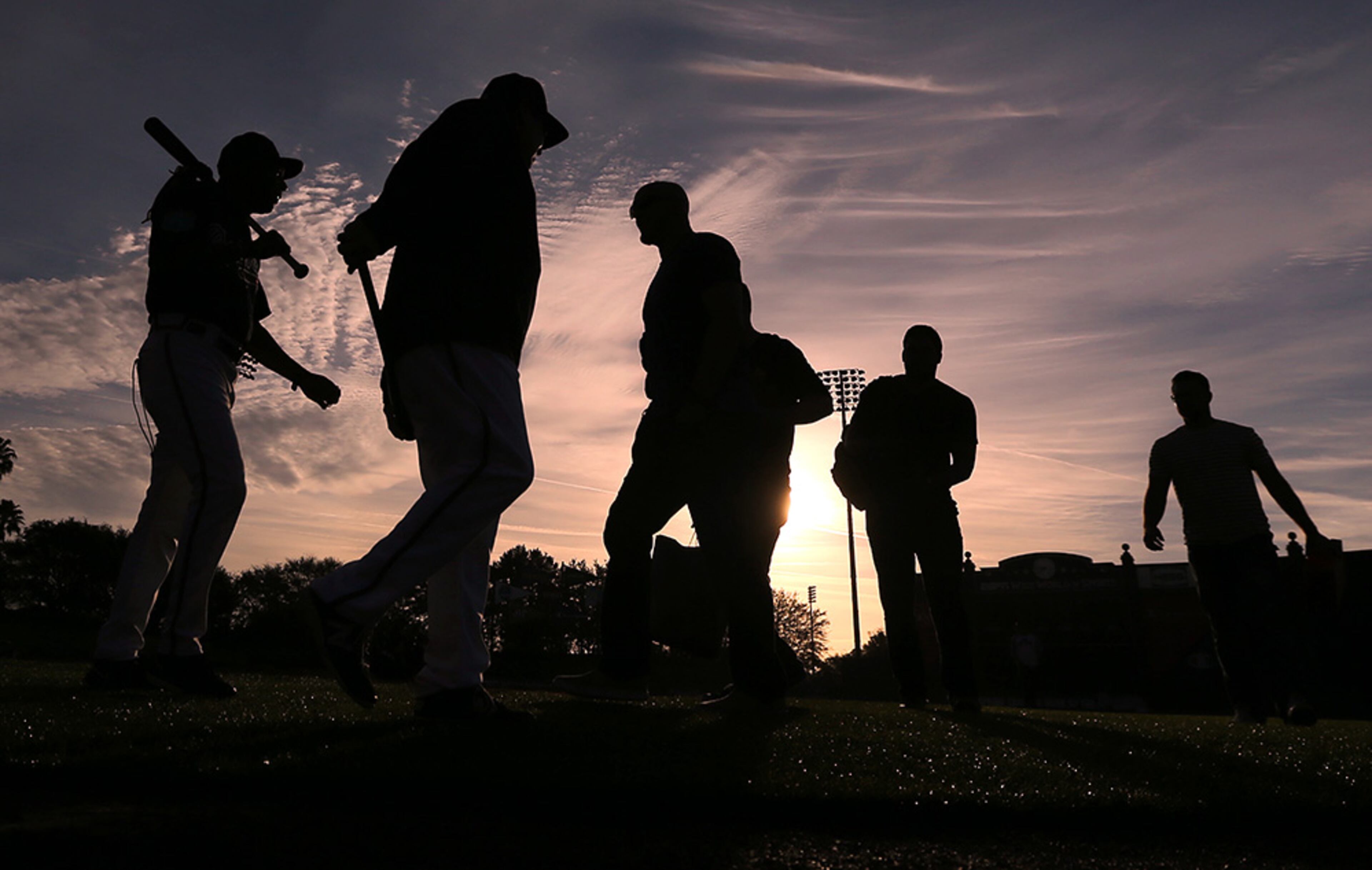 Braves coaches and players hit the field at sunrise Monday, Feb. 22, 2016, to begin a day of spring training at Champion Stadium on the ESPN Wide World of Sports in Lake Buena Vista, Fla.