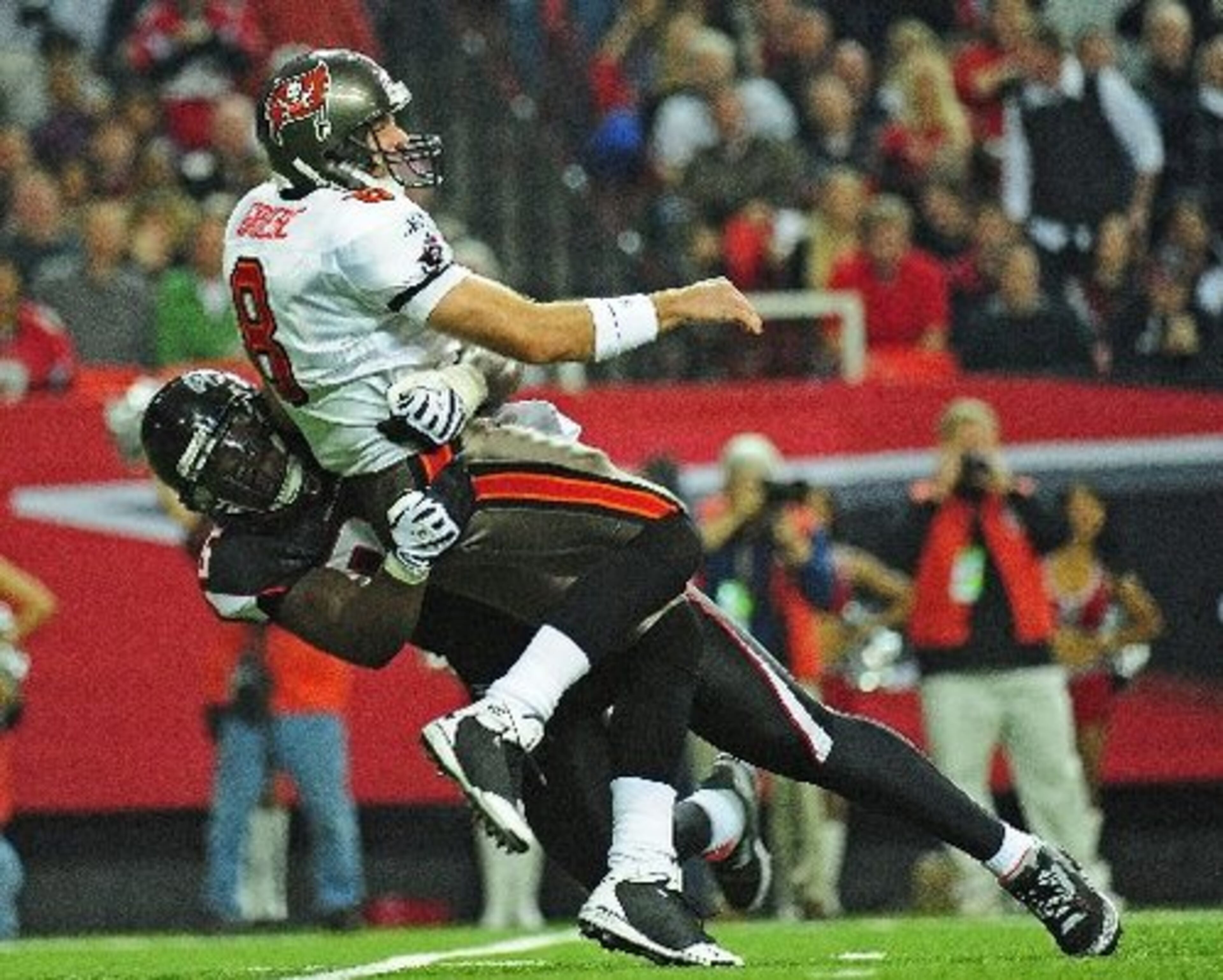 Bucs QB Griese gets away a pass just before he's taken down by the Falcons' Jonathan Babineaux in the third quarter.